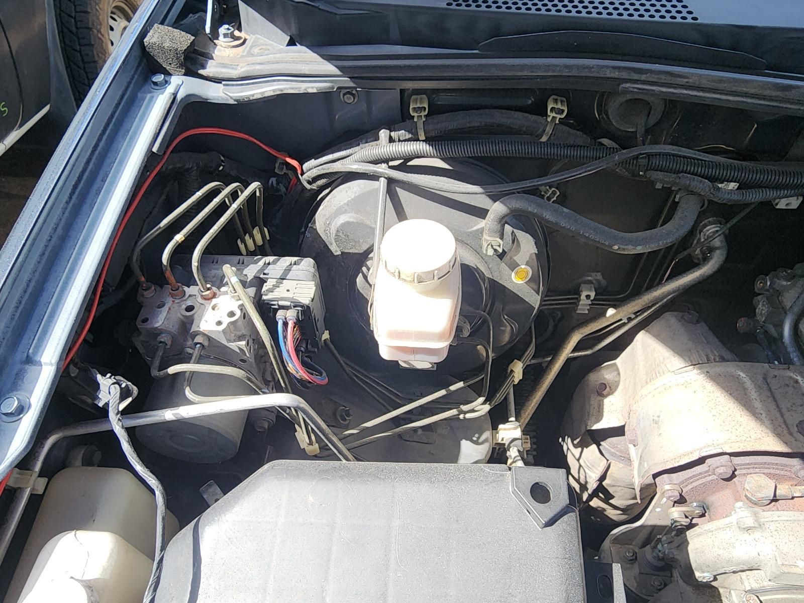 Car Engine Bay With Exposed Components — South West 4WD Wreckers In Harristown, QLD