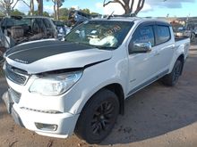 A Black Truck is Parked on the Side of the Road Next to a White Truck — South West 4WD Wreckers In Brisbane, QLD