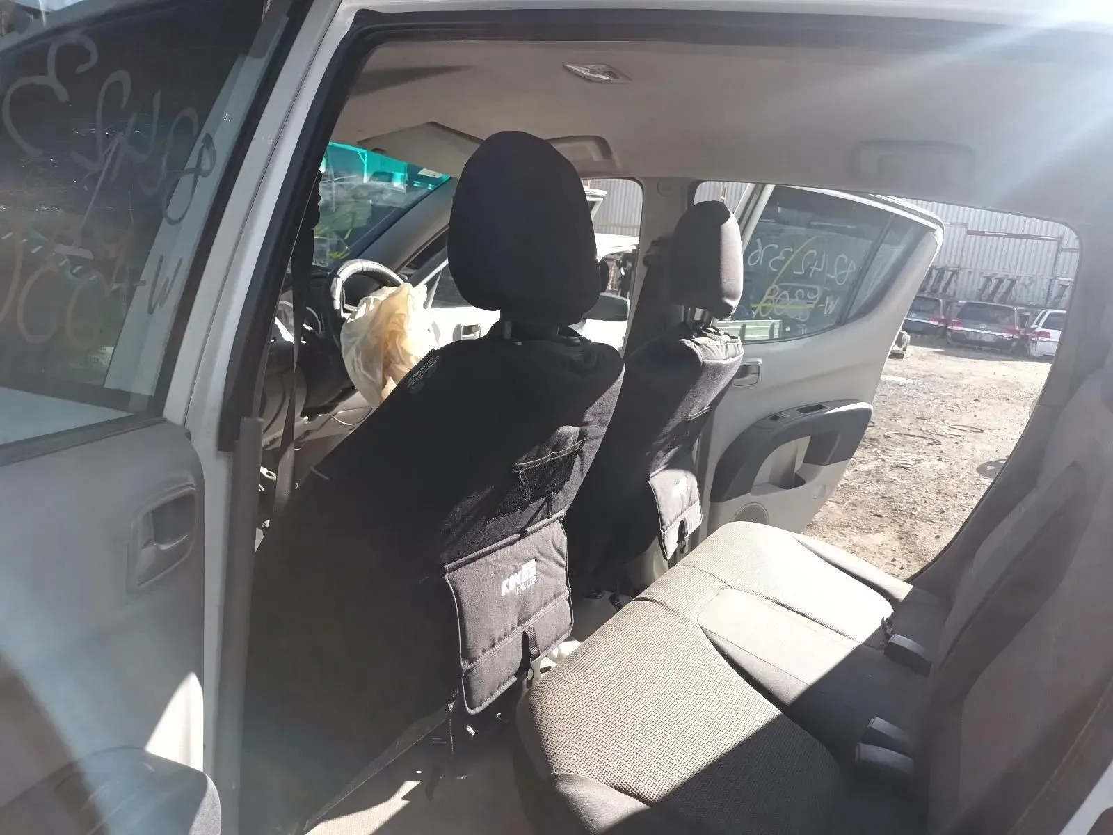 Interior of a White Car Showing Rear and Driver Seats — South West 4WD Wreckers In Brisbane, QLD