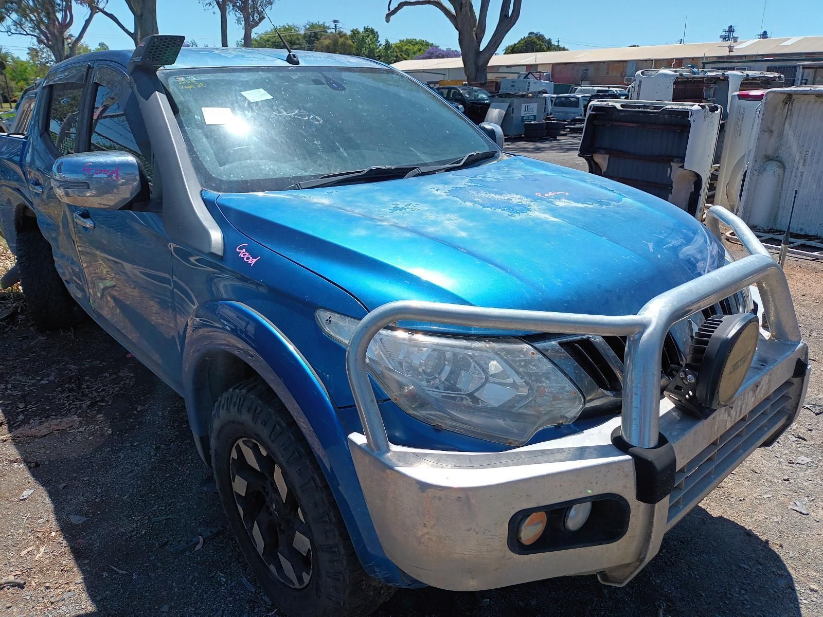 A Blue Truck with a Snorkel on Top of It is Parked in a Parking Lot — South West 4WD Wreckers In Brisbane, QLD