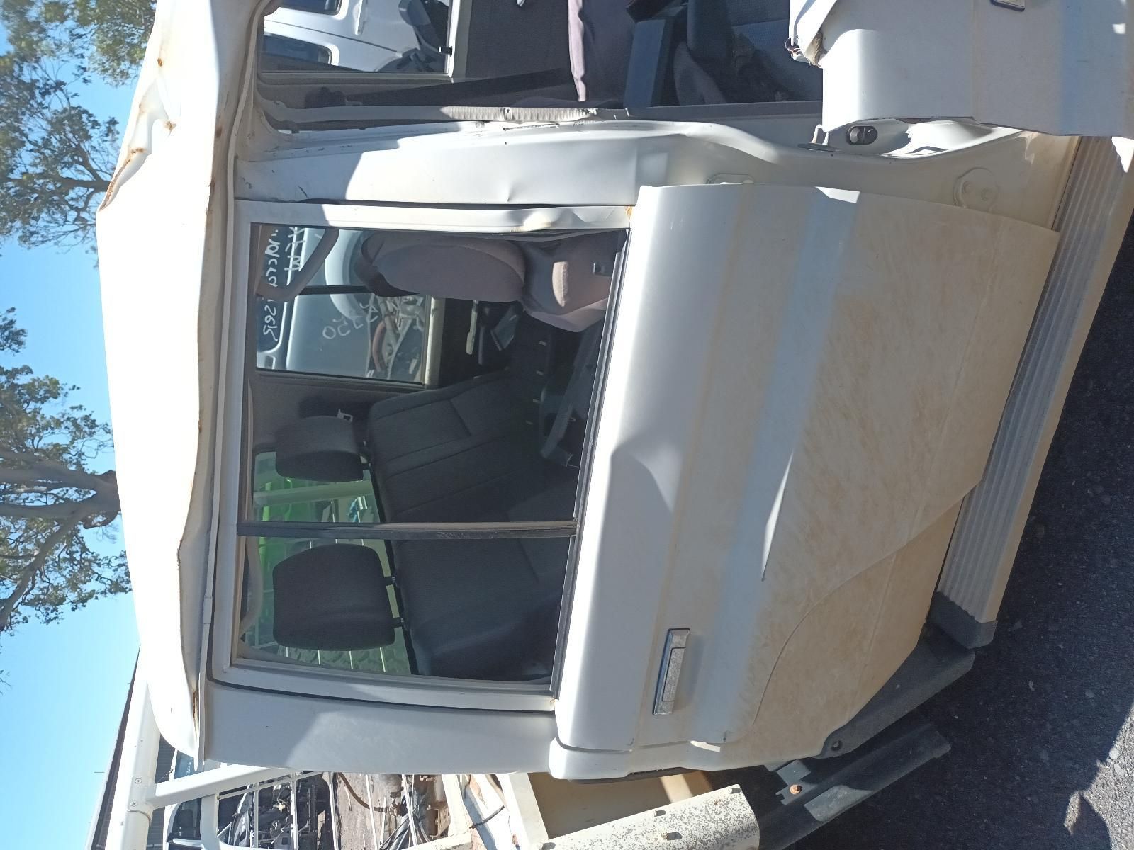 Overturned White Van on Roadside, with Shattered Windows and Debris Visible — South West 4WD Wreckers In Harristown, QLD