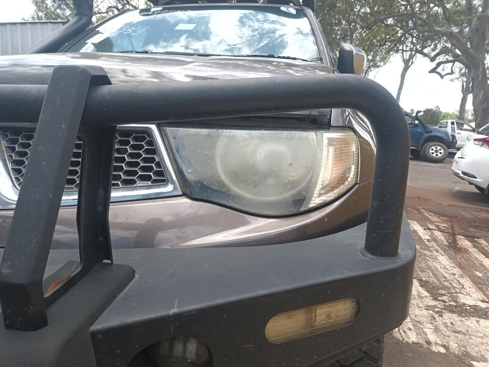 Front of A Black Suv with A Bull Bar, Close-Up of The Right Headlight and Bumper — South West 4WD Wreckers In Harristown, QLD