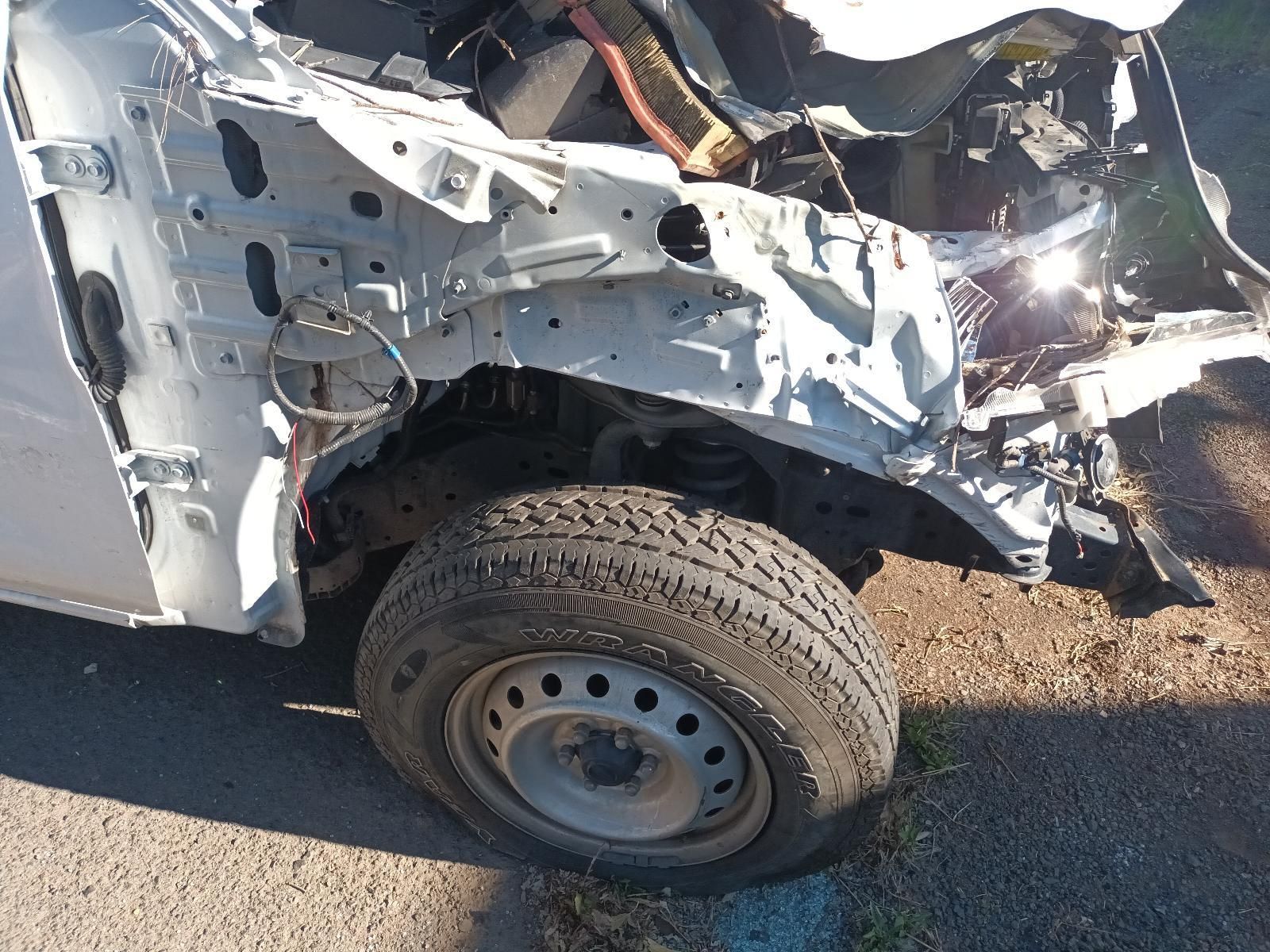Severely Damaged White Car Front End With a Crushed Fender — South West 4WD Wreckers In Harristown, QLD