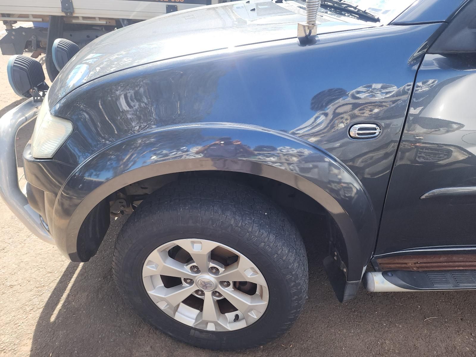 Close-up of a Black SUV’s Front Wheel — South West 4WD Wreckers In Harristown, QLD