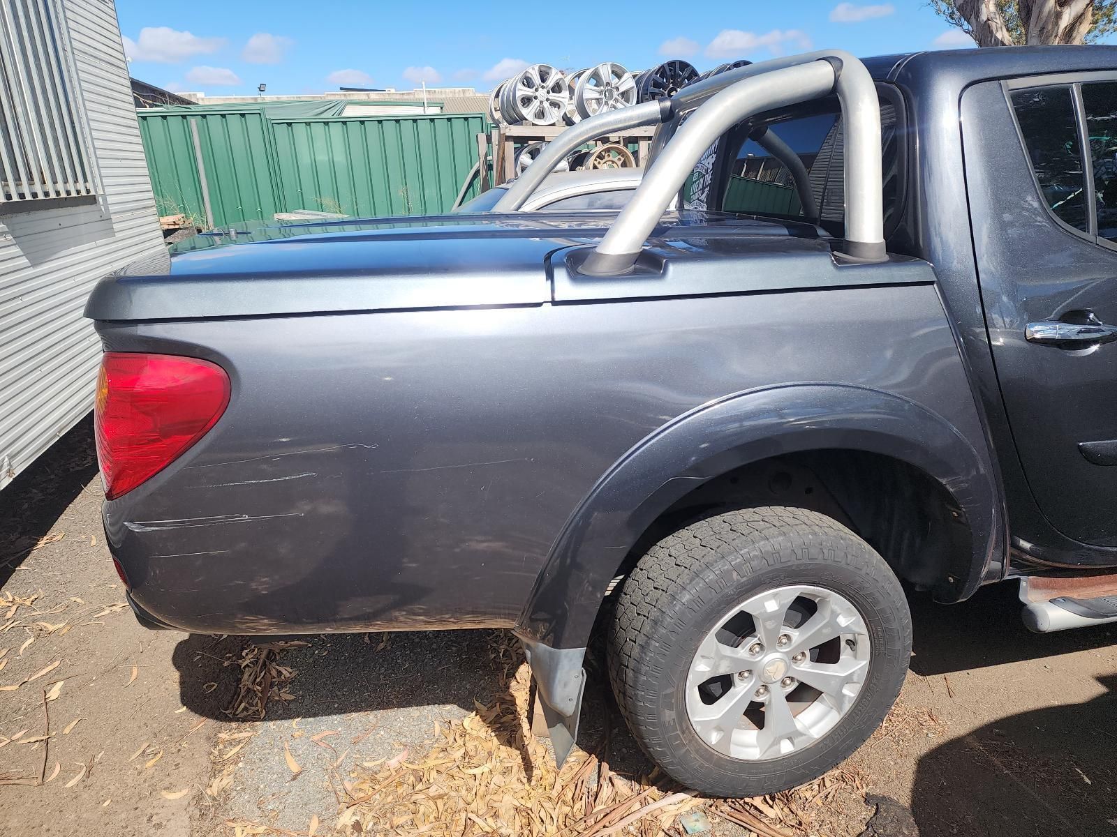 Side View of a Black Pickup Truck Bed With Roll Bars — South West 4WD Wreckers In Harristown, QLD