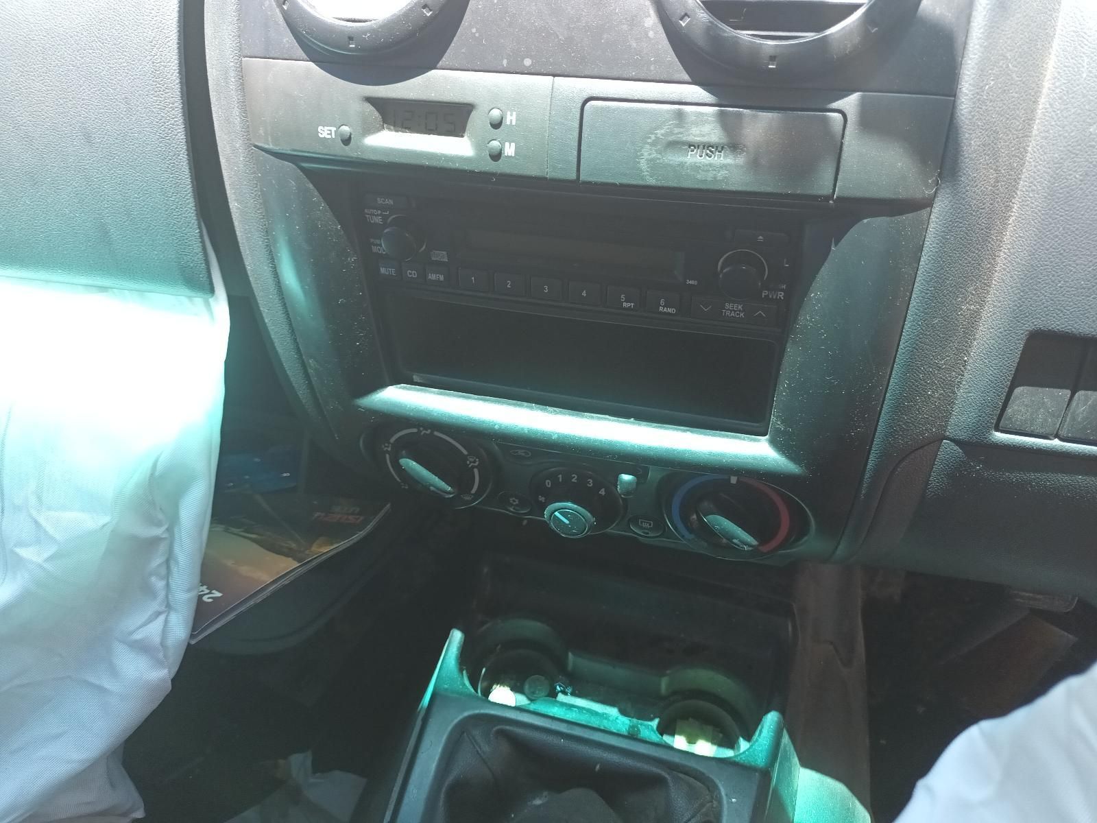 Car Dashboard Center Console with Radio, Vents, and Storage Area — South West 4WD Wreckers In Harristown, QLD