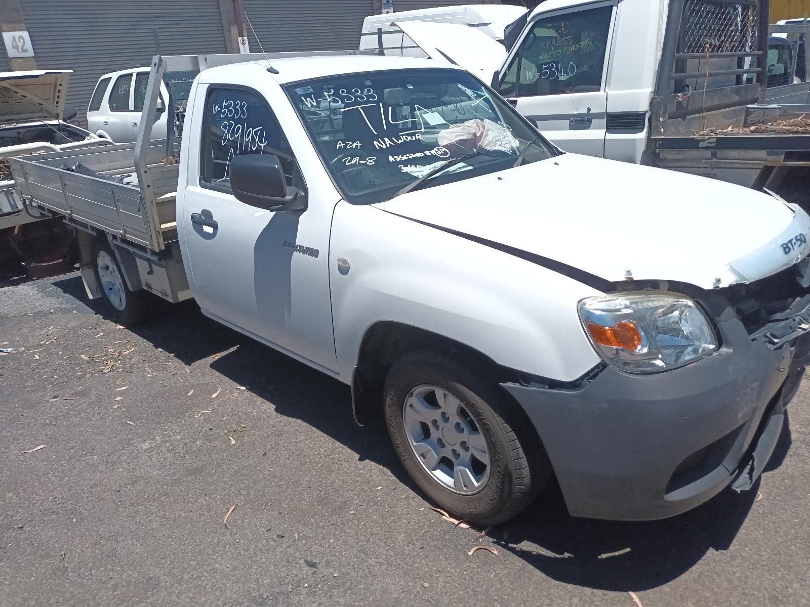 White Pickup Truck With a Flatbed Trailer — South West 4WD Wreckers In Harristown, QLD
