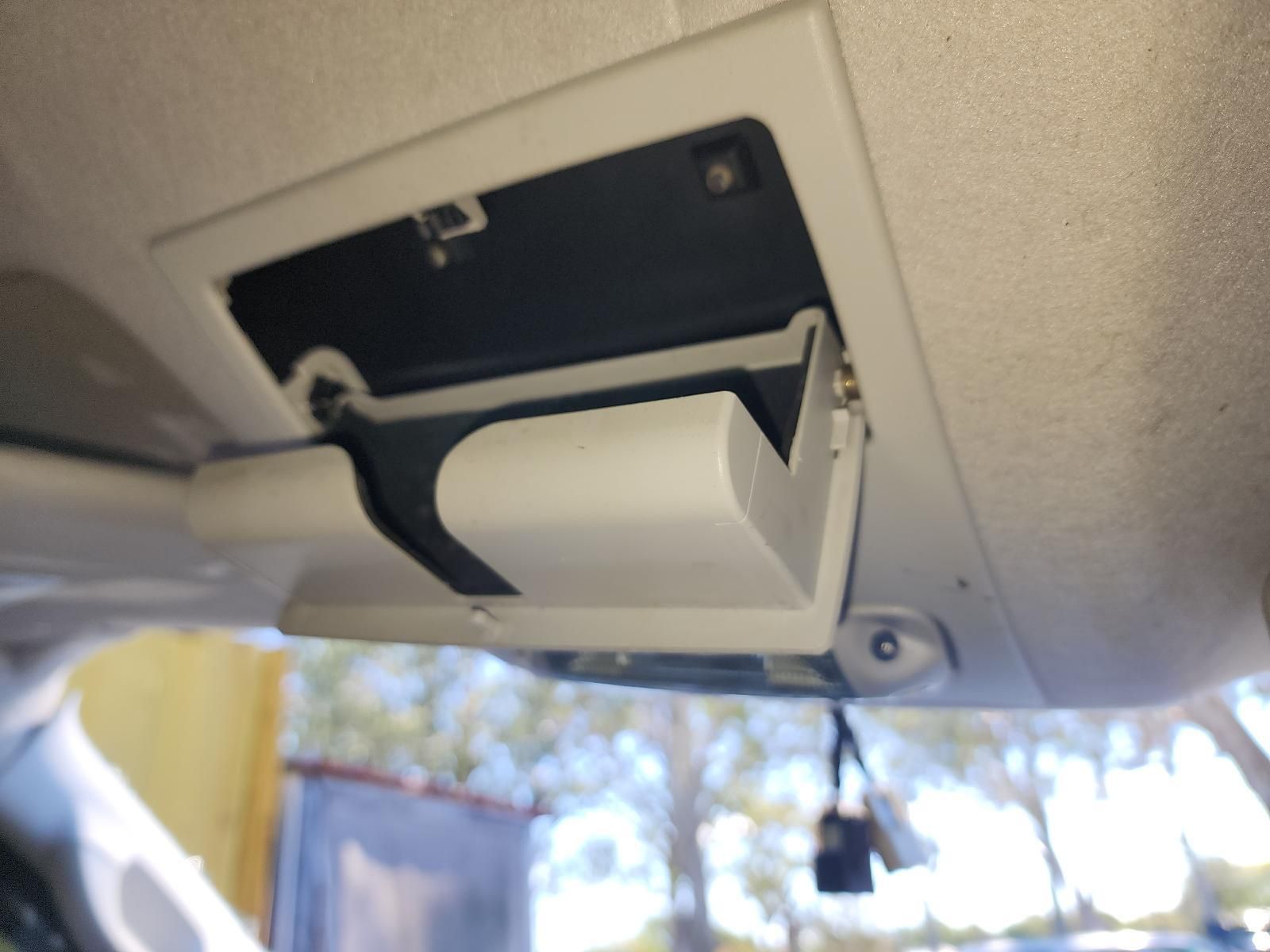 Open Car Sun Visor With a Small Black Device Mounted — South West 4WD Wreckers In Harristown, QLD