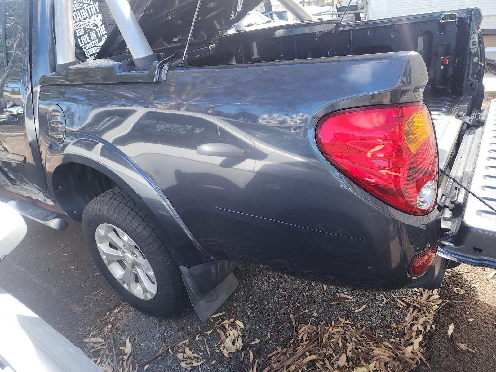 Dark Gray Pickup Truck Parked Outdoors — South West 4WD Wreckers In Harristown, QLD