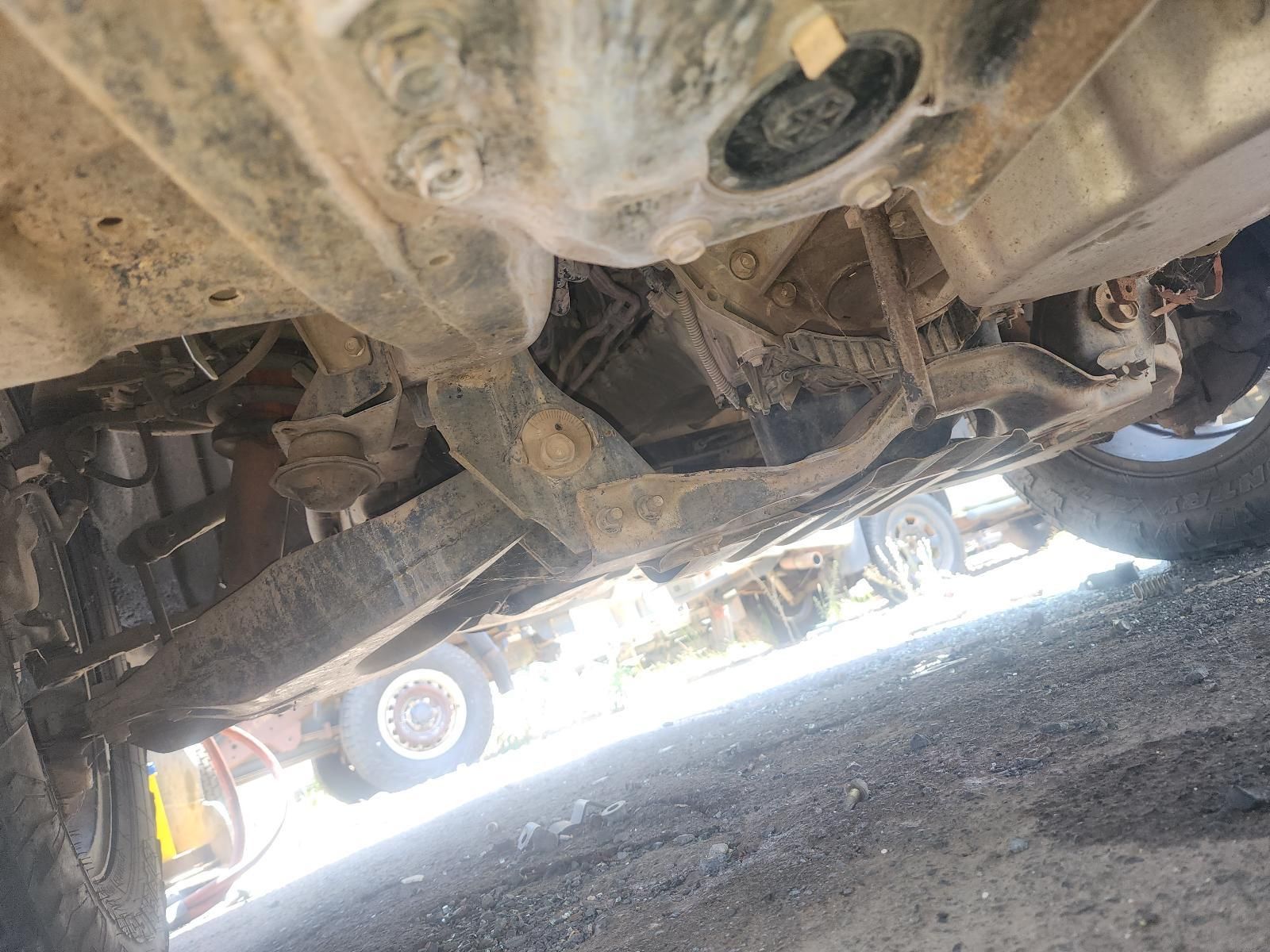 Underneath a Dusty Vehicle, Showing the Undercarriage — South West 4WD Wreckers In Harristown, QLD