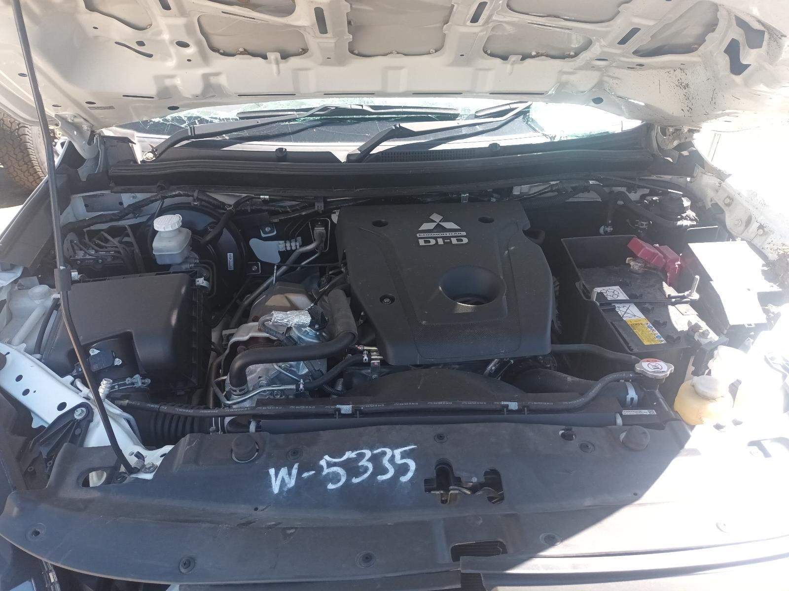 Open Car Hood Showing Engine Bay and Battery, Front Bumper Marked W-5335 — South West 4WD Wreckers In Harristown, QLD