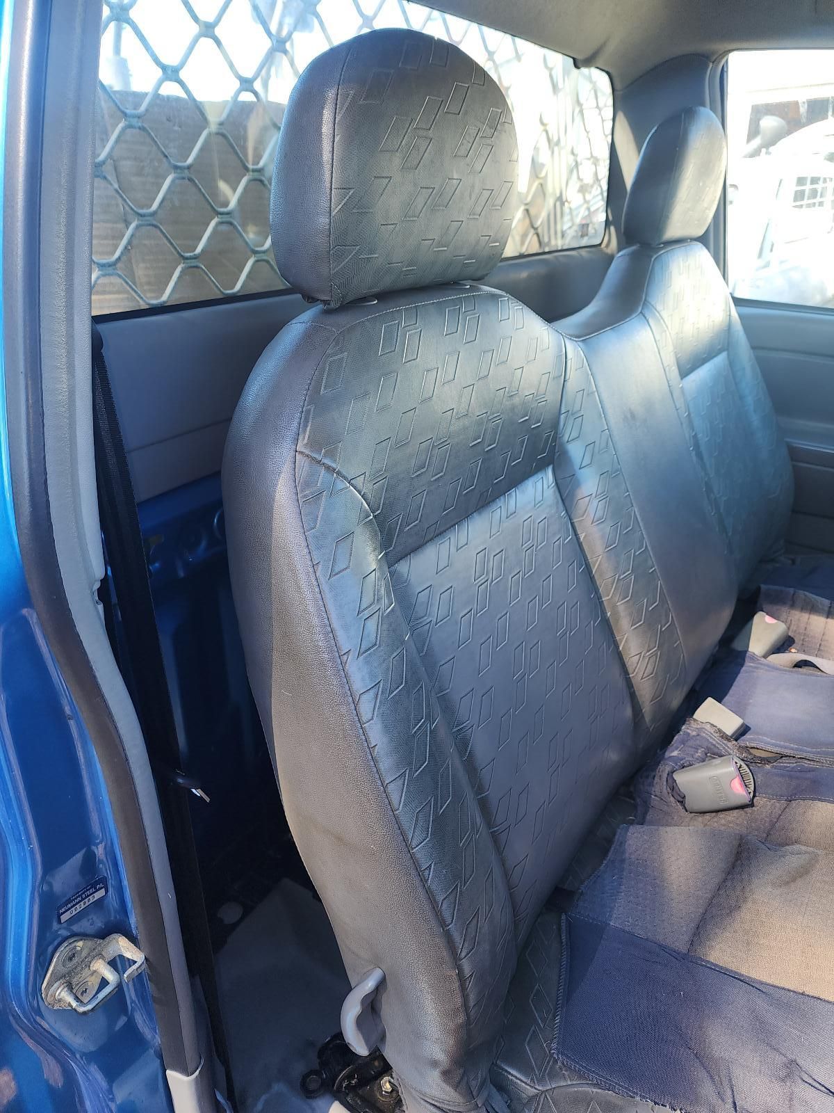 Blue Car Interior With Worn Gray Front Seats — South West 4WD Wreckers In Harristown, QLD