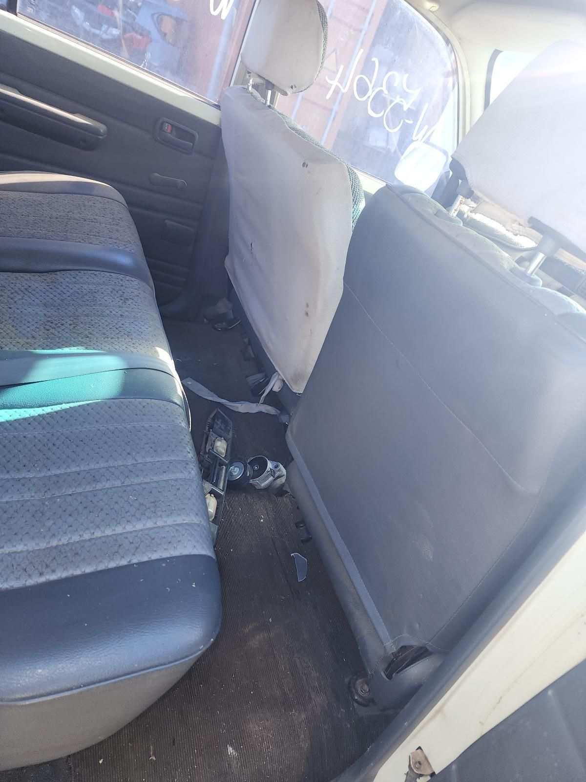 Car Interior with Two Grey Fabric Seats and A Black Floor — South West 4WD Wreckers In Harristown, QLD