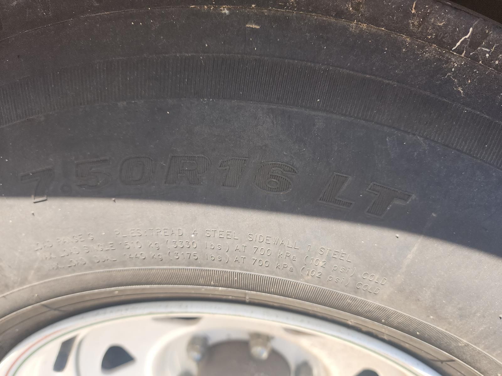 Close-Up of A Worn Tyre Sidewall Above a Silver Wheel Rim — South West 4WD Wreckers In Harristown, QLD