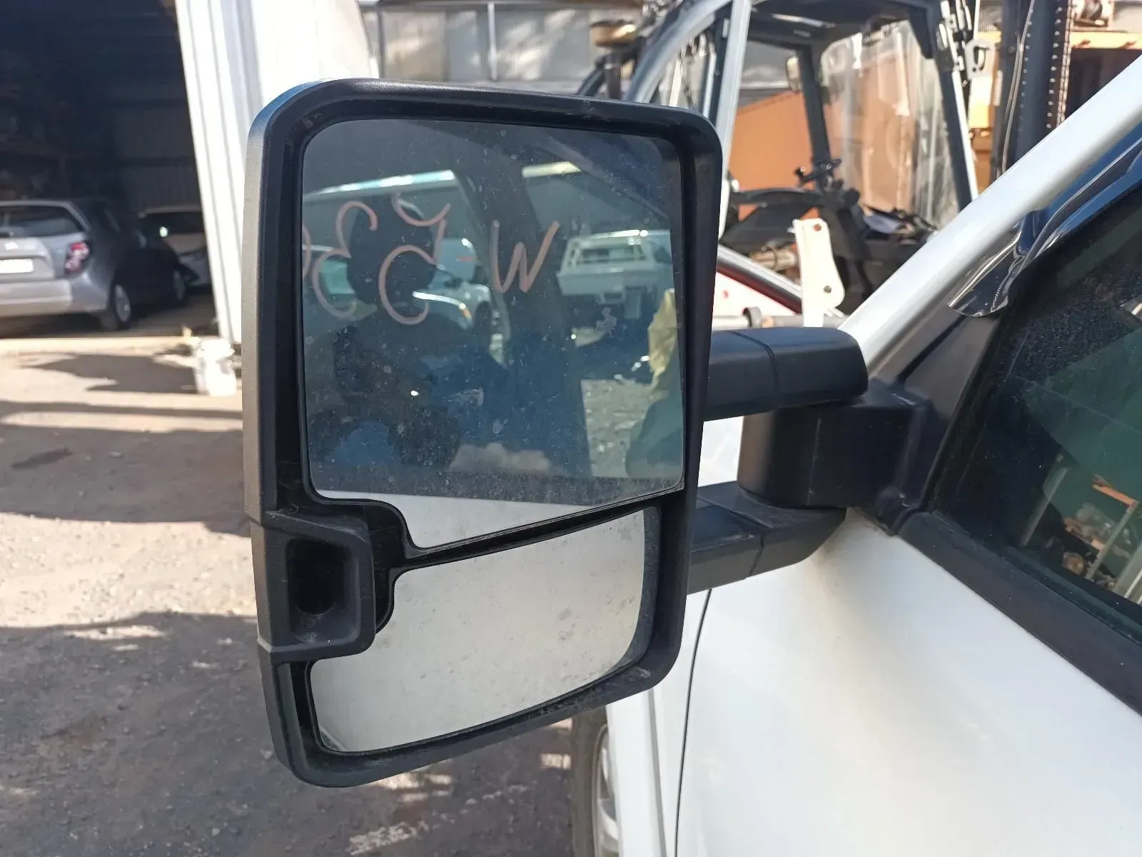 Truck Side Mirror, Black Frame, Reflecting a Sunny Outdoor Scene — South West 4WD Wreckers In Brisbane, QLD