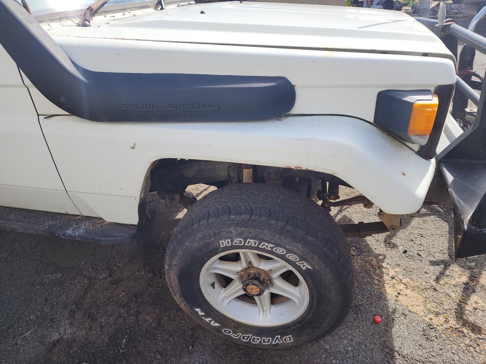 White Off-road Vehicle Front Fender With Tire — South West 4WD Wreckers In Harristown, QLD