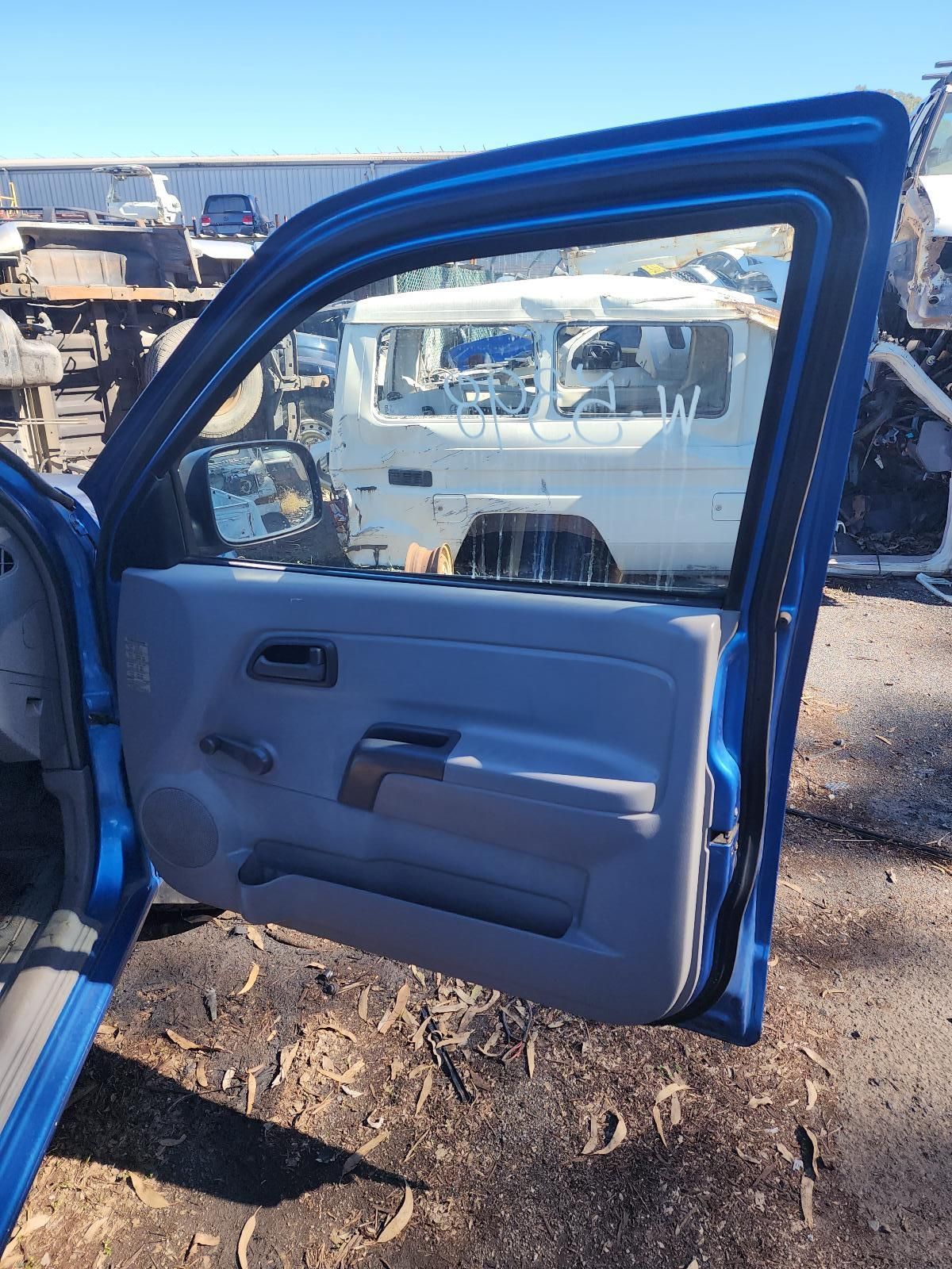Blue Truck Door Open at an Auto Yard — South West 4WD Wreckers In Harristown, QLD