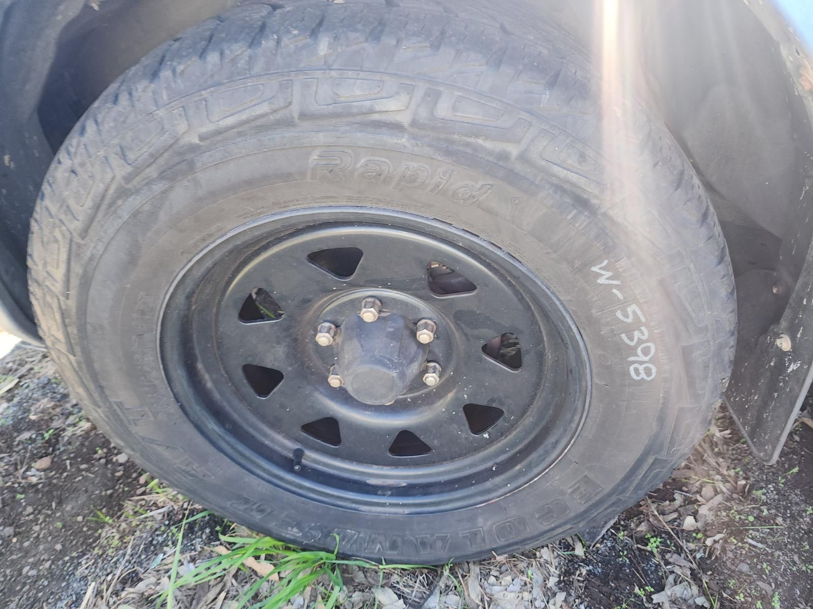 Flat Car Tire on a Black Steel Rim — South West 4WD Wreckers In Harristown, QLD