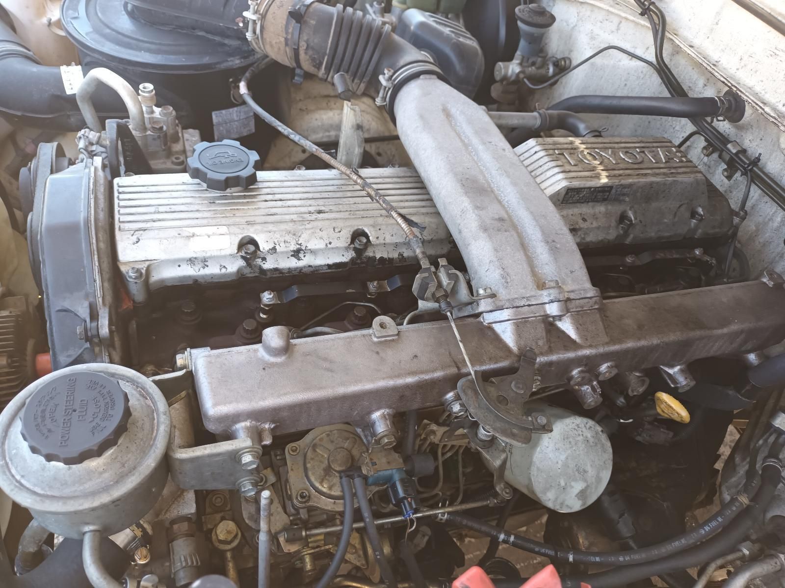 Close-Up of A Car Engine Bay with Hoses, Metal Components — South West 4WD Wreckers In Harristown, QLD