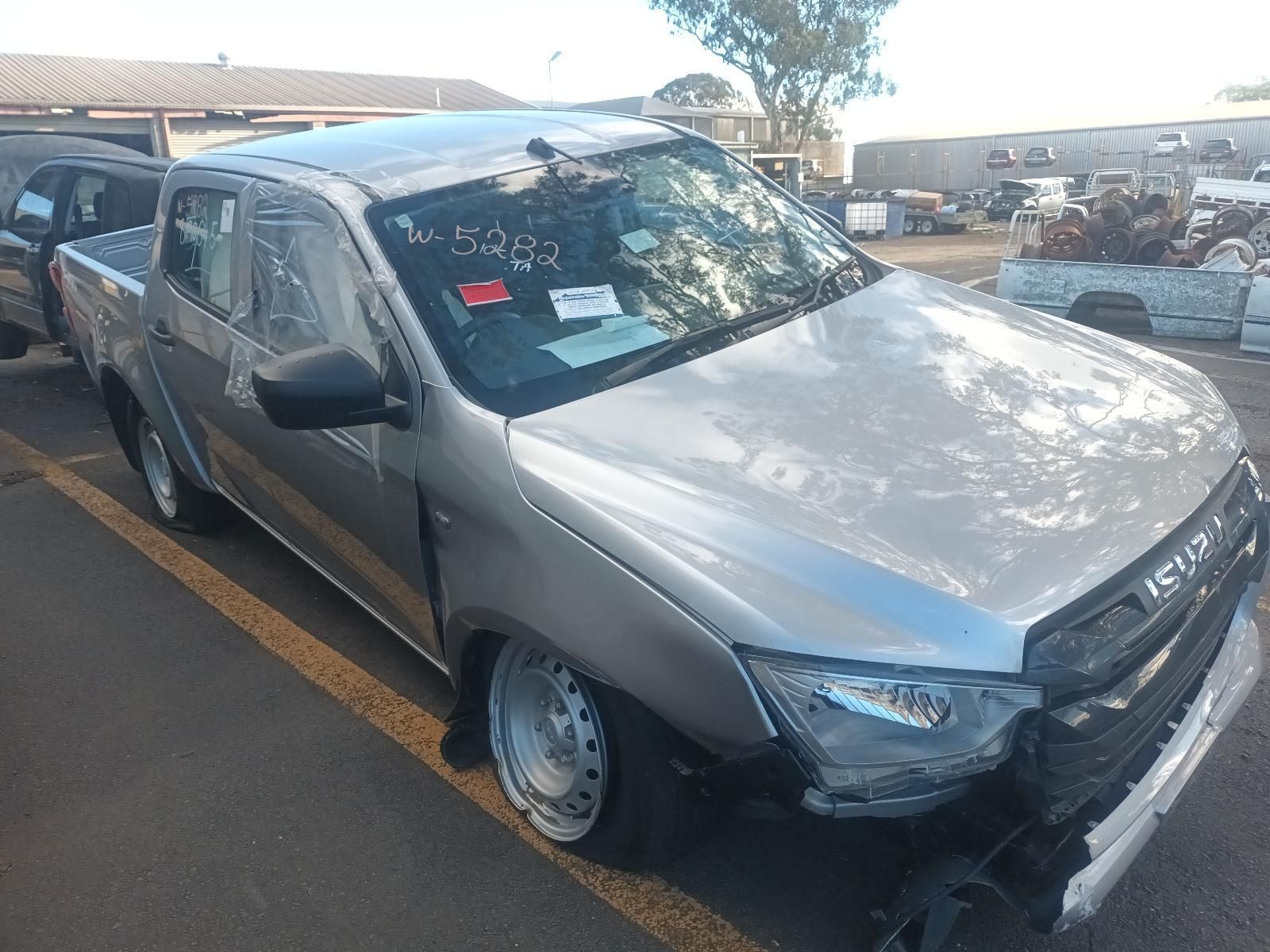 A Silver Pickup Truck is Parked in a Parking Lot — South West 4WD Wreckers In Brisbane, QLD
