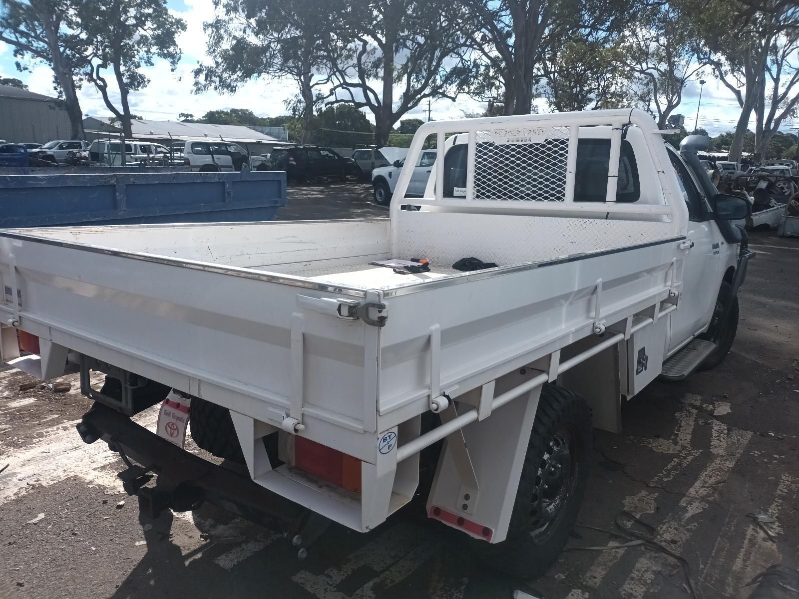 A White Truck with a Flat Bed is Parked in a Parking Lot — South West 4WD Wreckers In Brisbane, QLD
