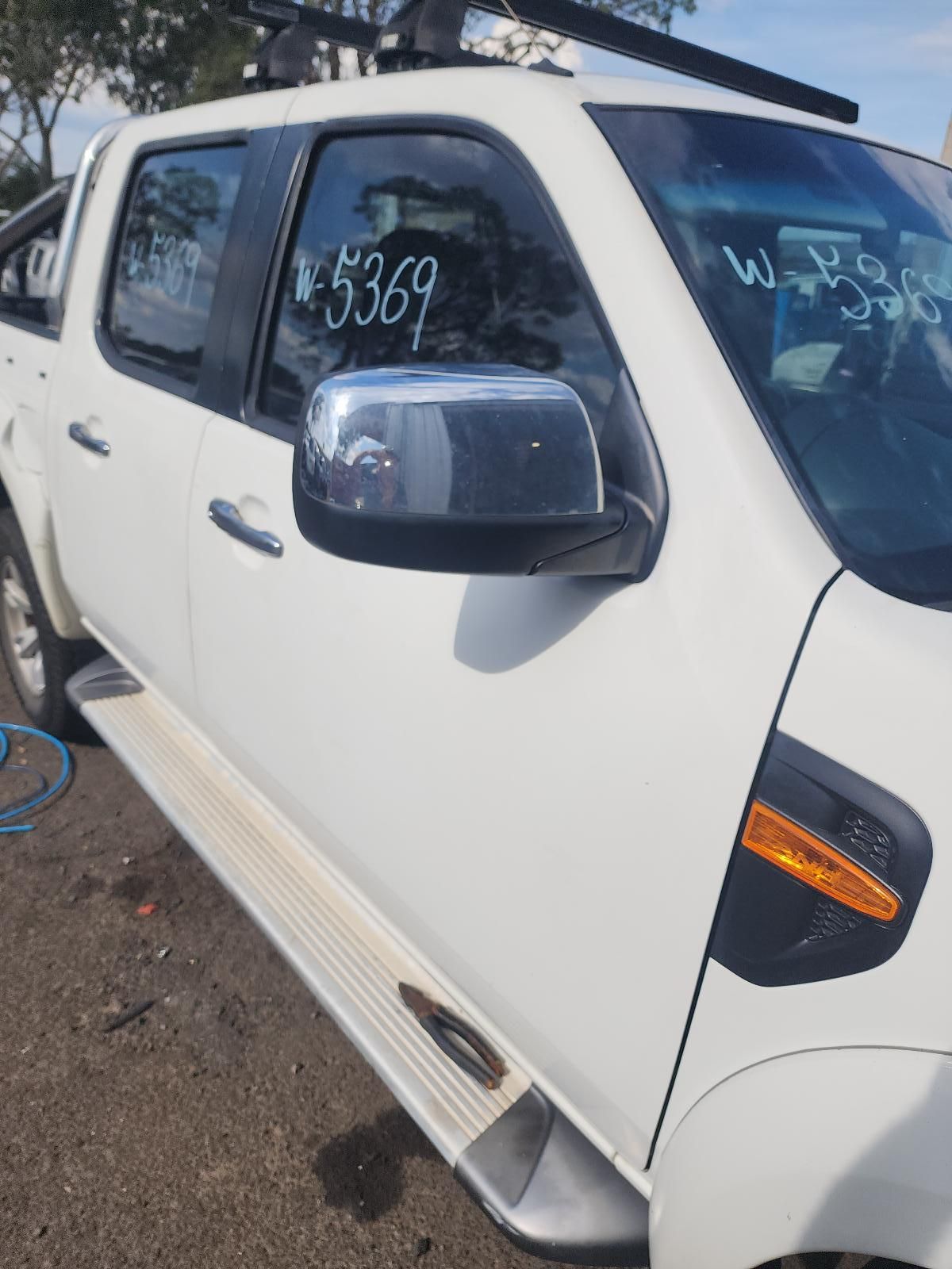 White Pickup Truck Side View With Chrome Mirror — South West 4WD Wreckers In Harristown, QLD