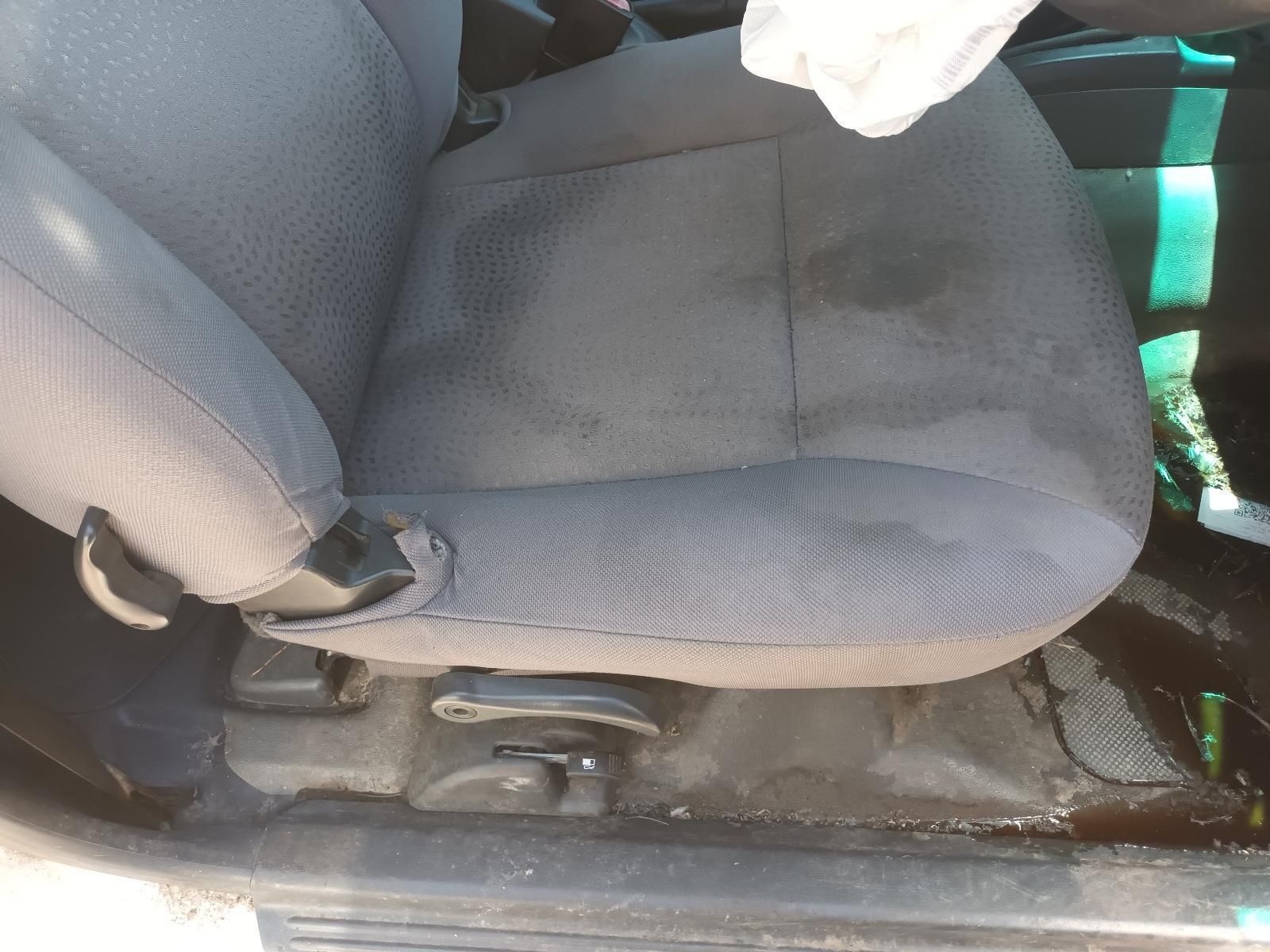 Car Seat with Dark Grey Cushion and Visible Water Stain — South West 4WD Wreckers In Harristown, QLD