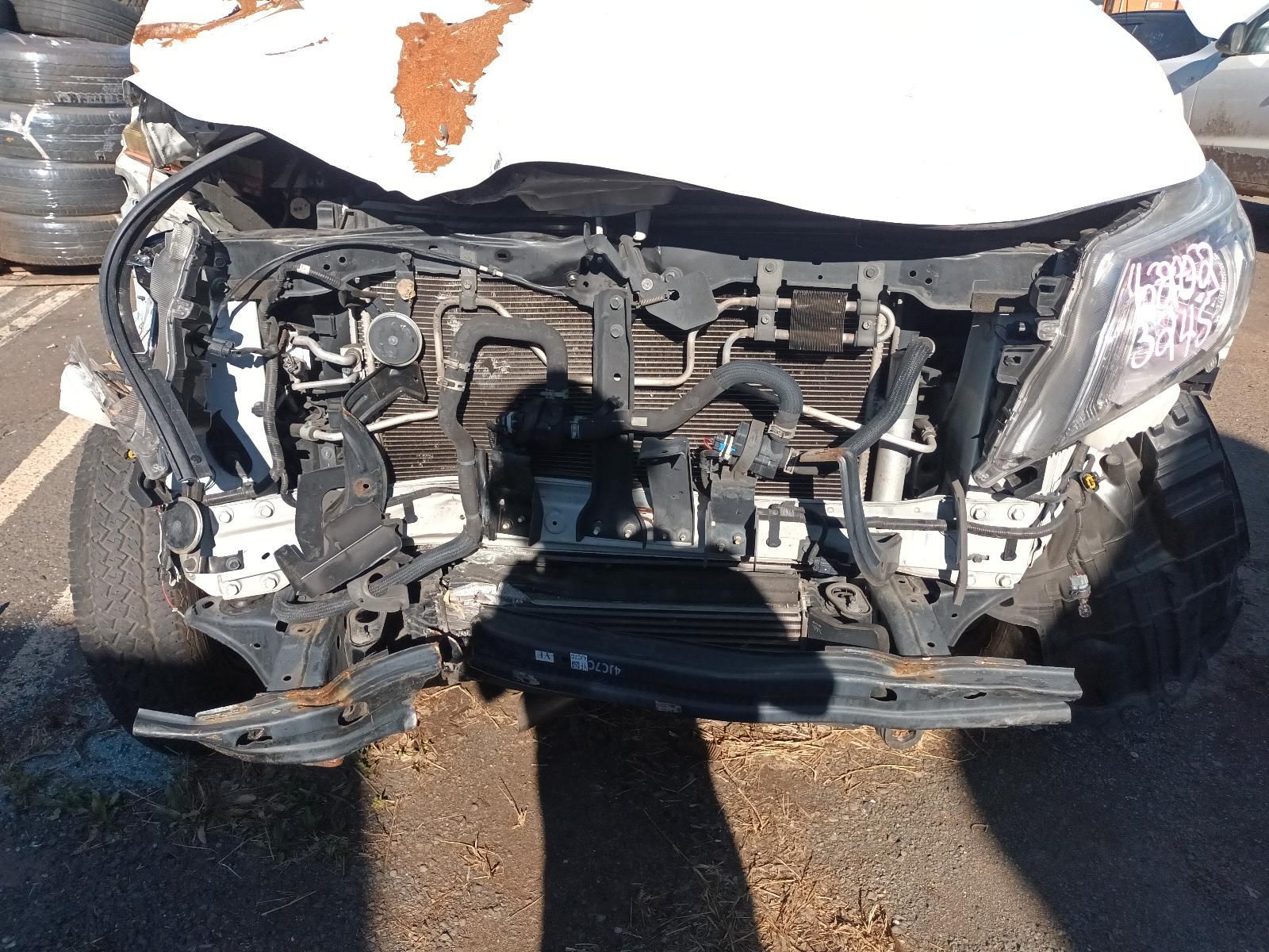 Front View of a White Car With Severe Front-end Damage — South West 4WD Wreckers In Harristown, QLD