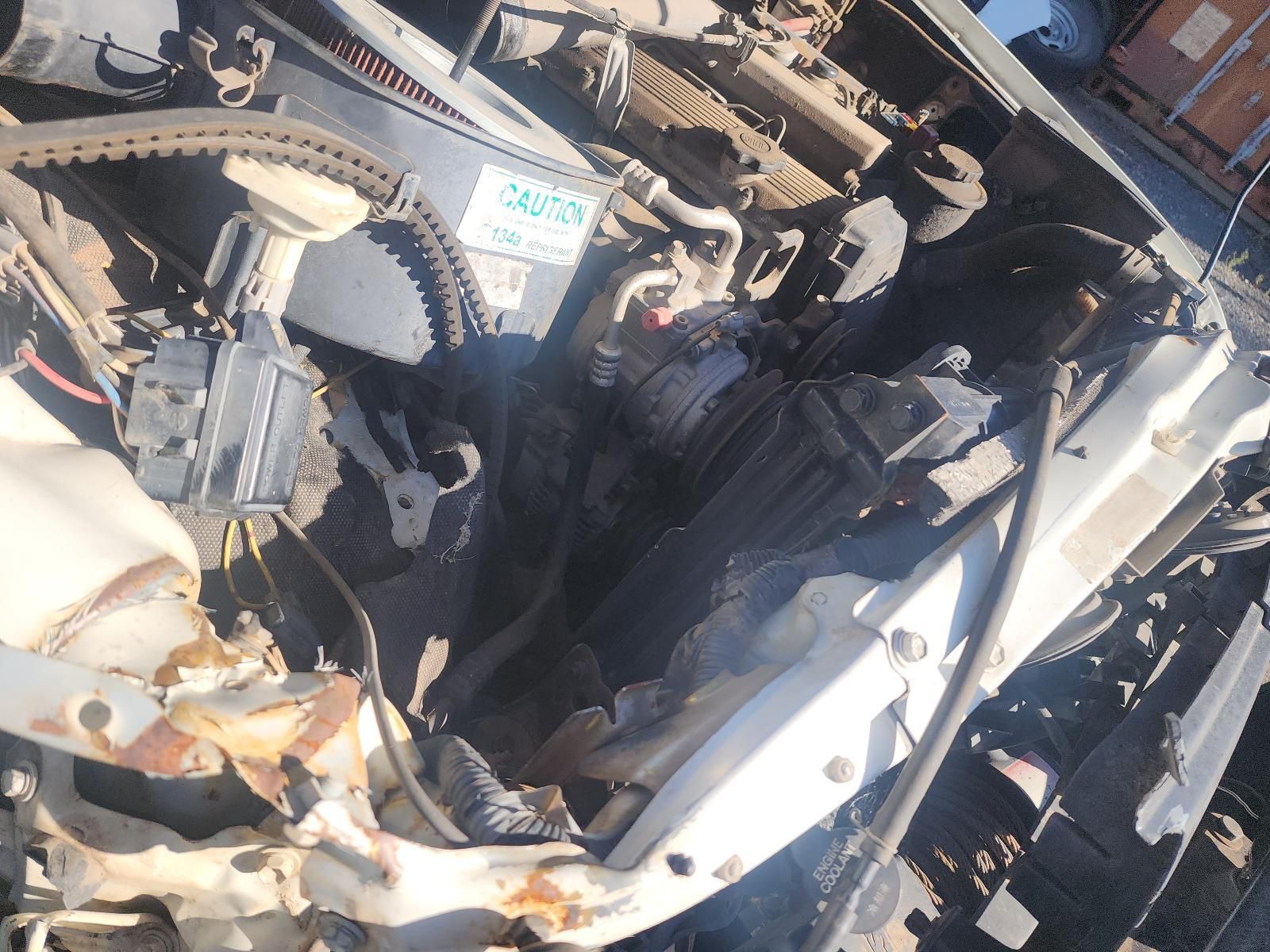 Severely Damaged Car Engine Bay with Twisted Metal — South West 4WD Wreckers In Harristown, QLD