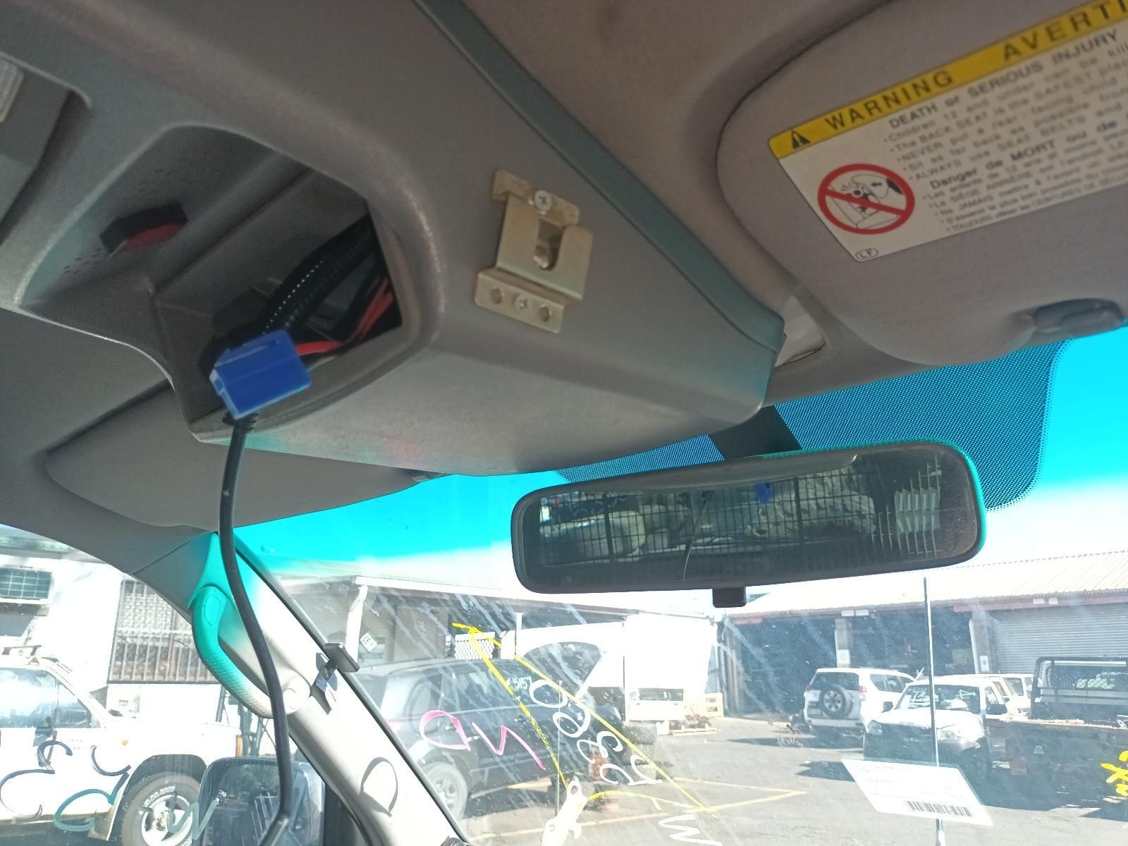Car Interior with Rearview Mirror and Sun Visors — South West 4WD Wreckers In Harristown, QLD