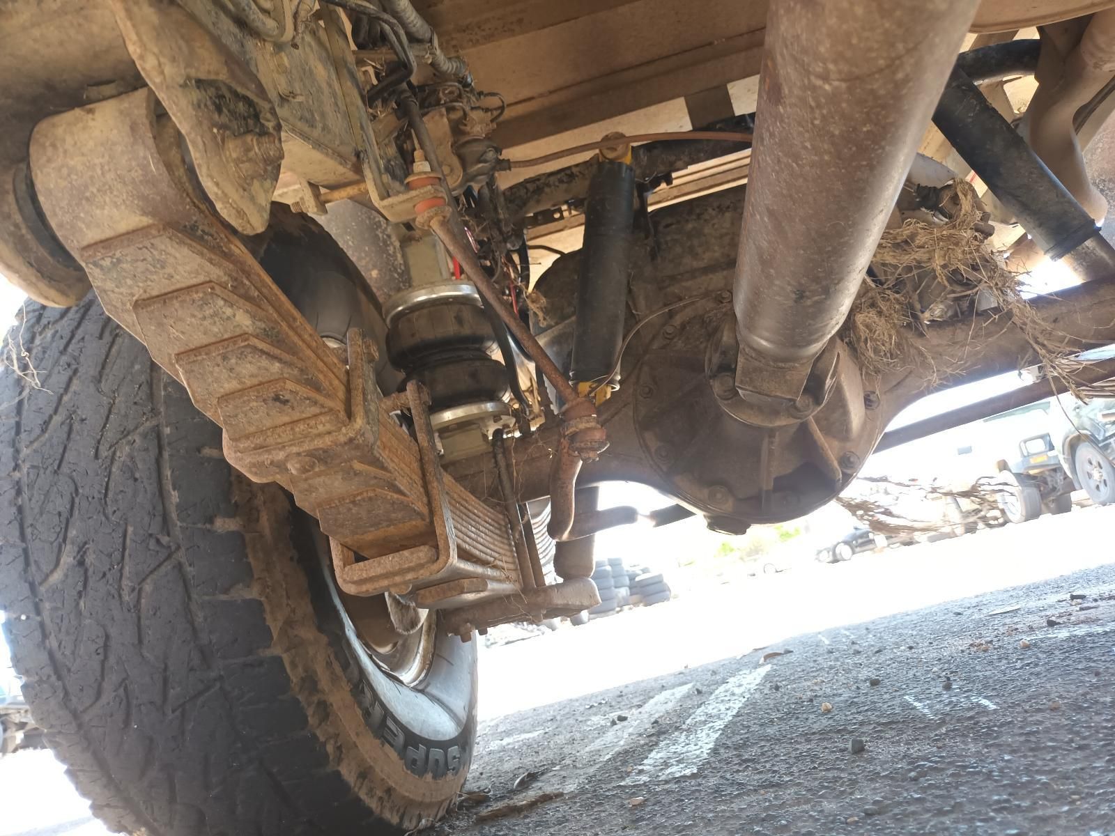 Underneath a Muddy Off-Road Vehicle, Showing the Suspension — South West 4WD Wreckers In Harristown, QLD
