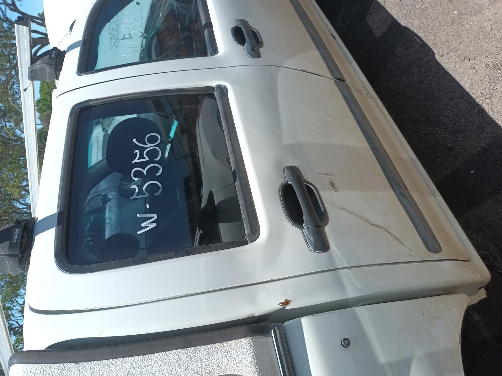 White Pickup Truck Parked on A Roadside, Viewed from The Side — South West 4WD Wreckers In Harristown, QLD