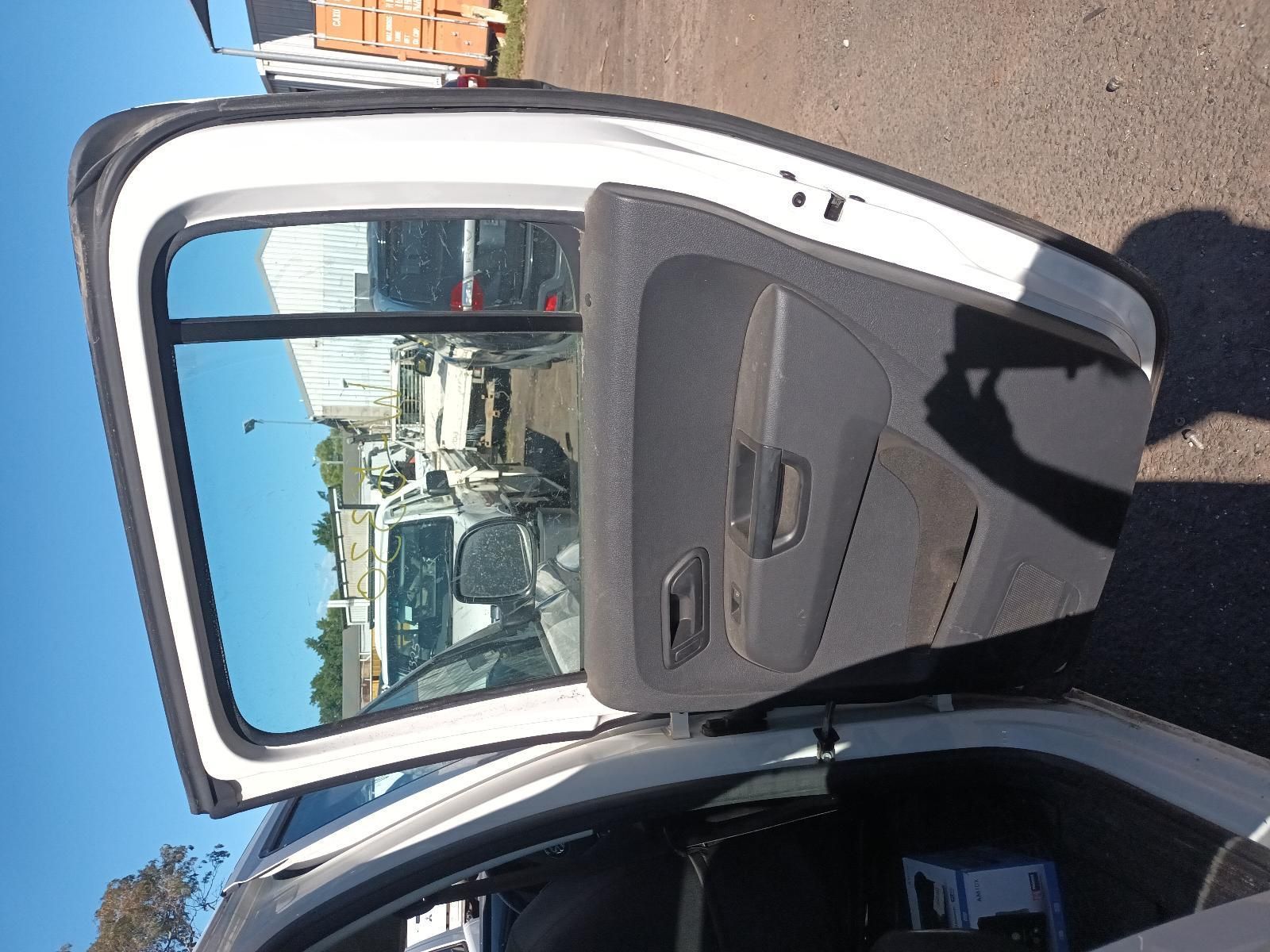 Open Car Door with Gray Interior, Viewed from Outside on A Sunny Street — South West 4WD Wreckers In Harristown, QLD