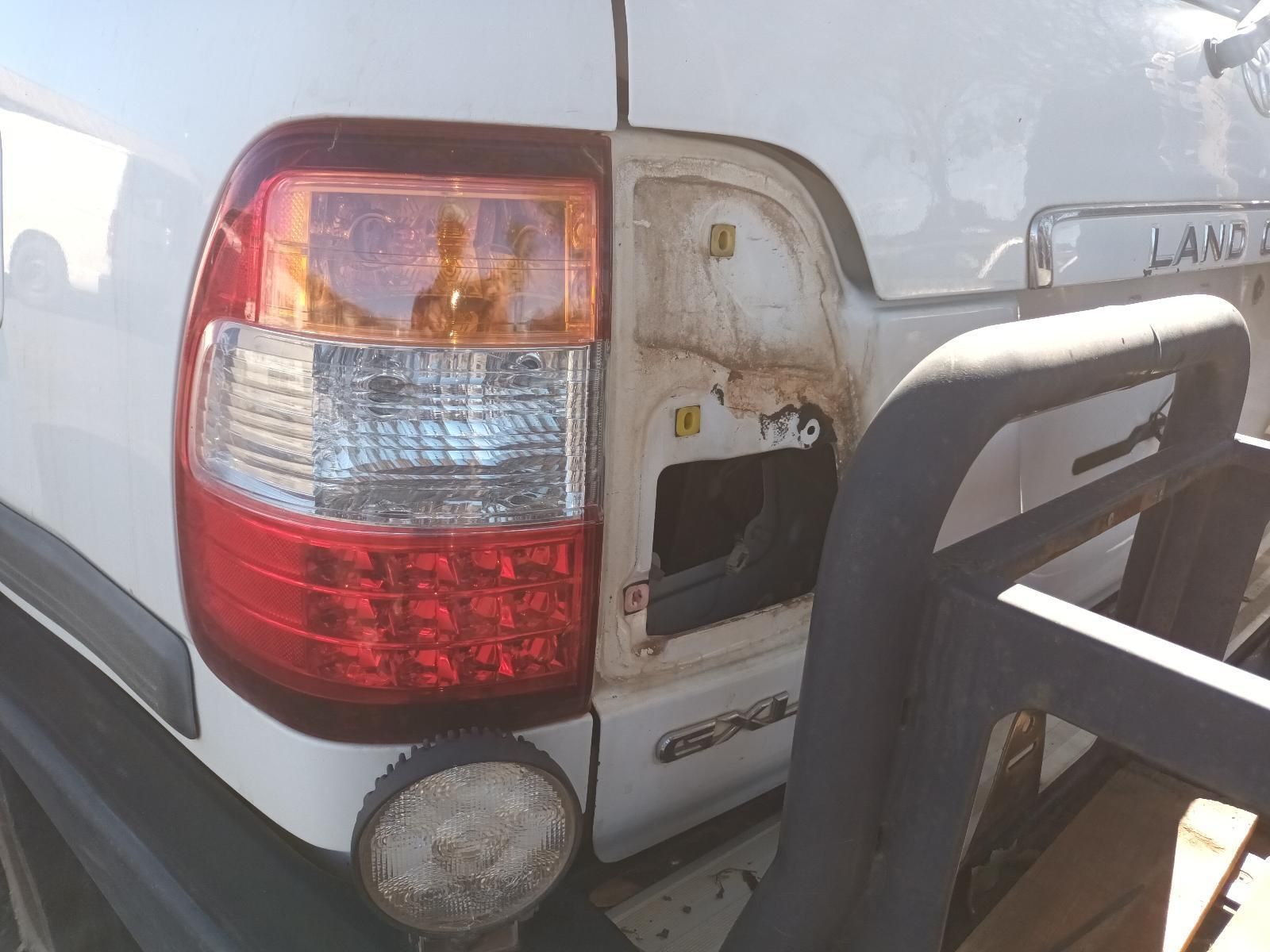 Damaged White Pickup Truck Rear with Broken Taillight — South West 4WD Wreckers In Harristown, QLD