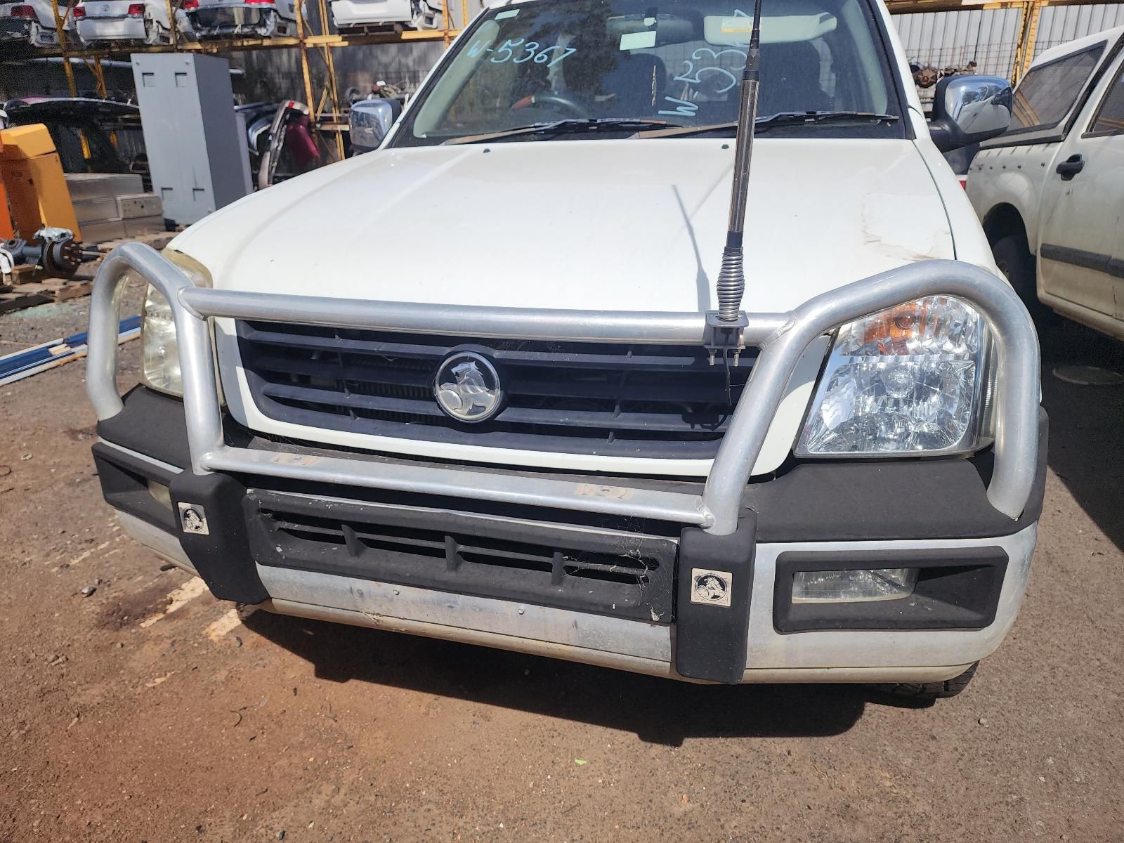 White SUV With Bull Bar Parked in a Dusty Lot — South West 4WD Wreckers In Harristown, QLD
