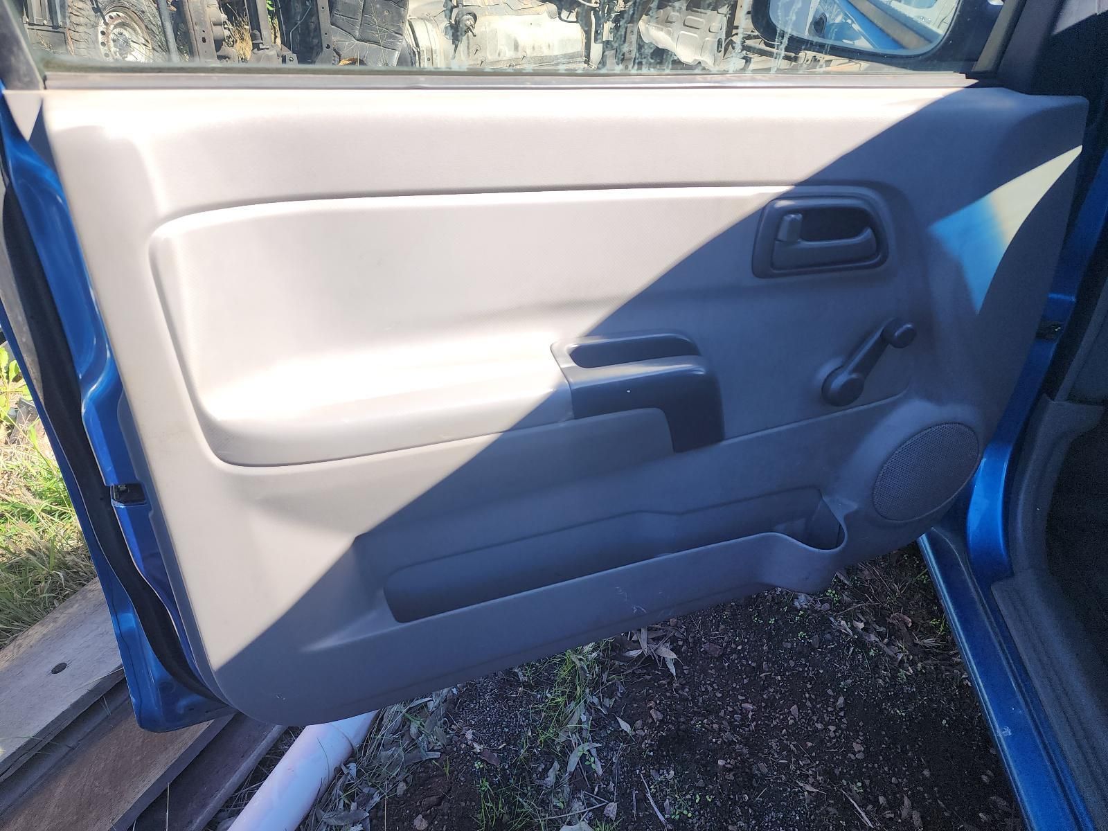 Open Car Door With Beige and Dark Gray Interior Panel — South West 4WD Wreckers In Harristown, QLD