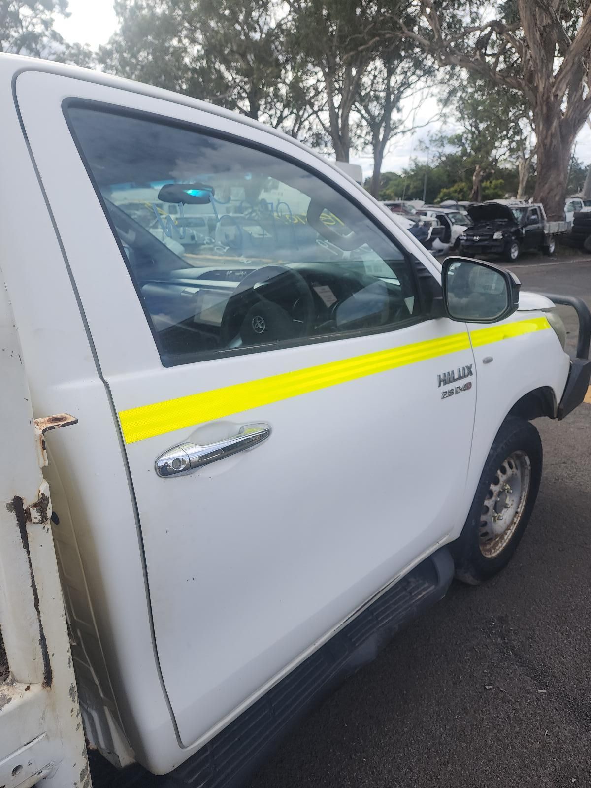 White Utility Truck With a Yellow Stripe Parked — South West 4WD Wreckers In Harristown, QLD