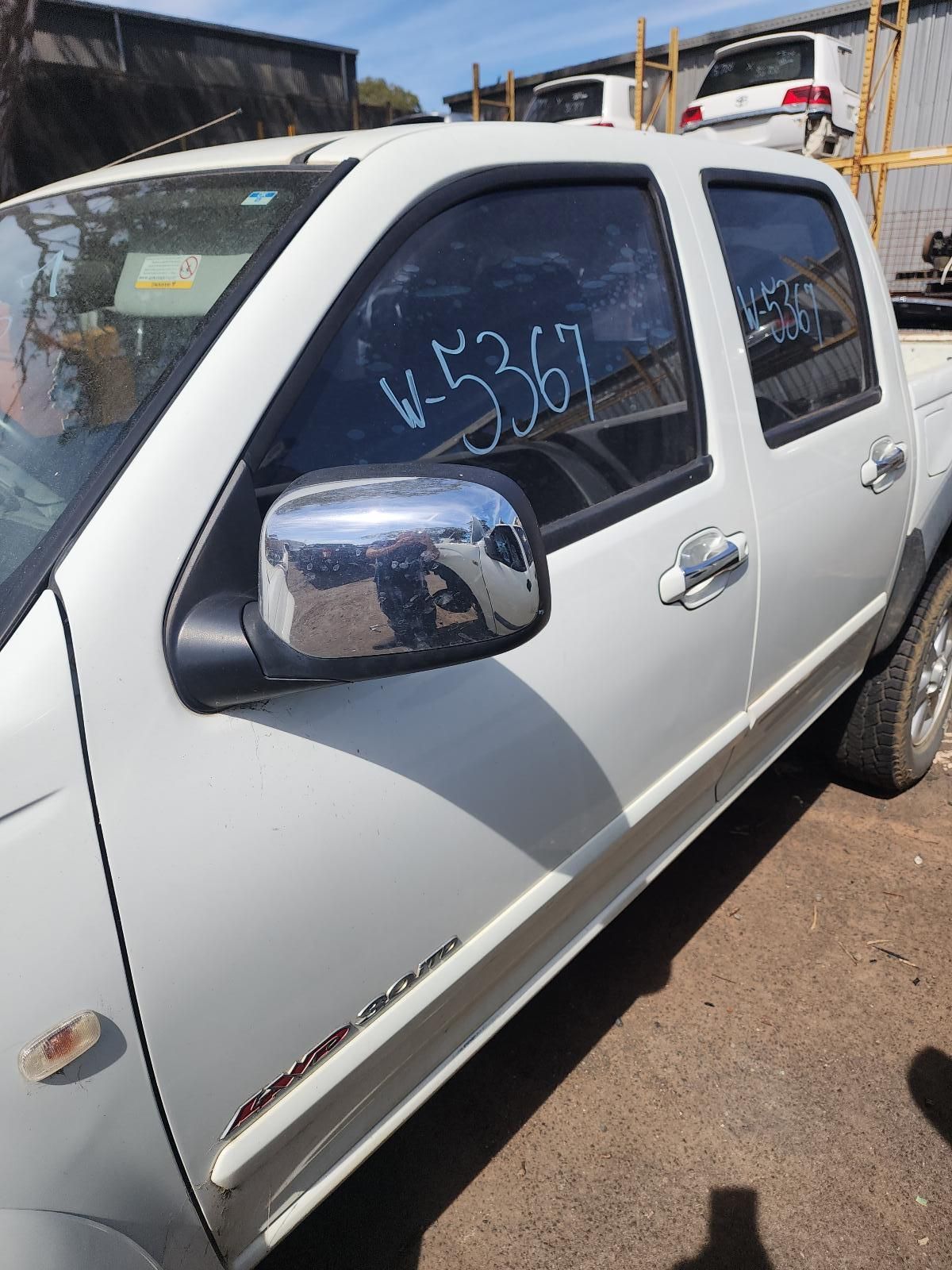 White Pickup Truck Parked in a Lot — South West 4WD Wreckers In Harristown, QLD