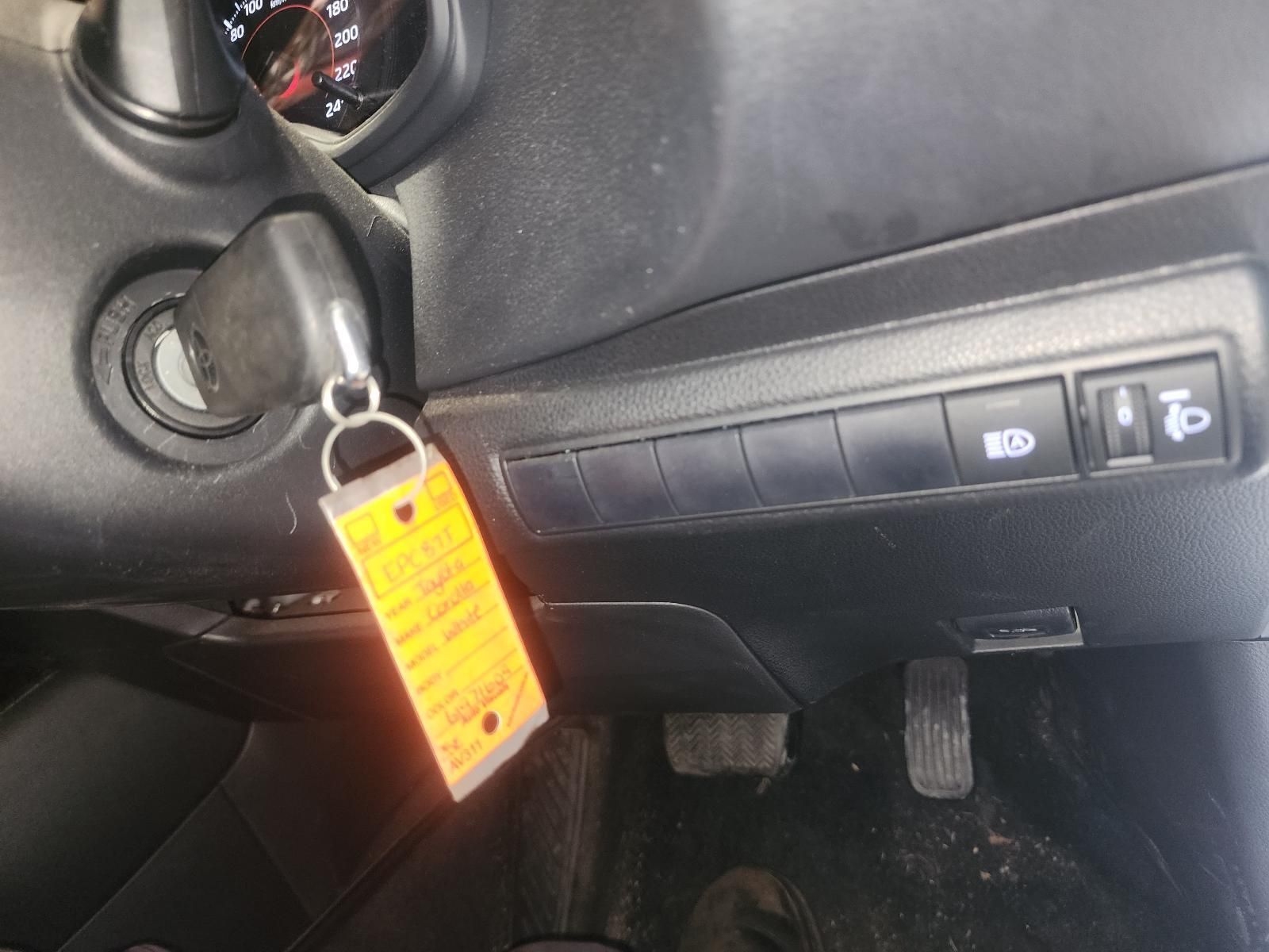 Car Key in Ignition With Yellow Tag, Dashboard Controls — South West 4WD Wreckers In Harristown, QLD