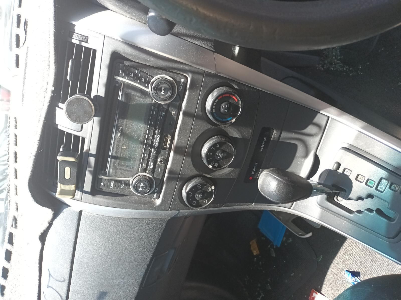 Car Dashboard Center Console with Radio, Climate Controls, and Gear Shifter — South West 4WD Wreckers In Harristown, QLD