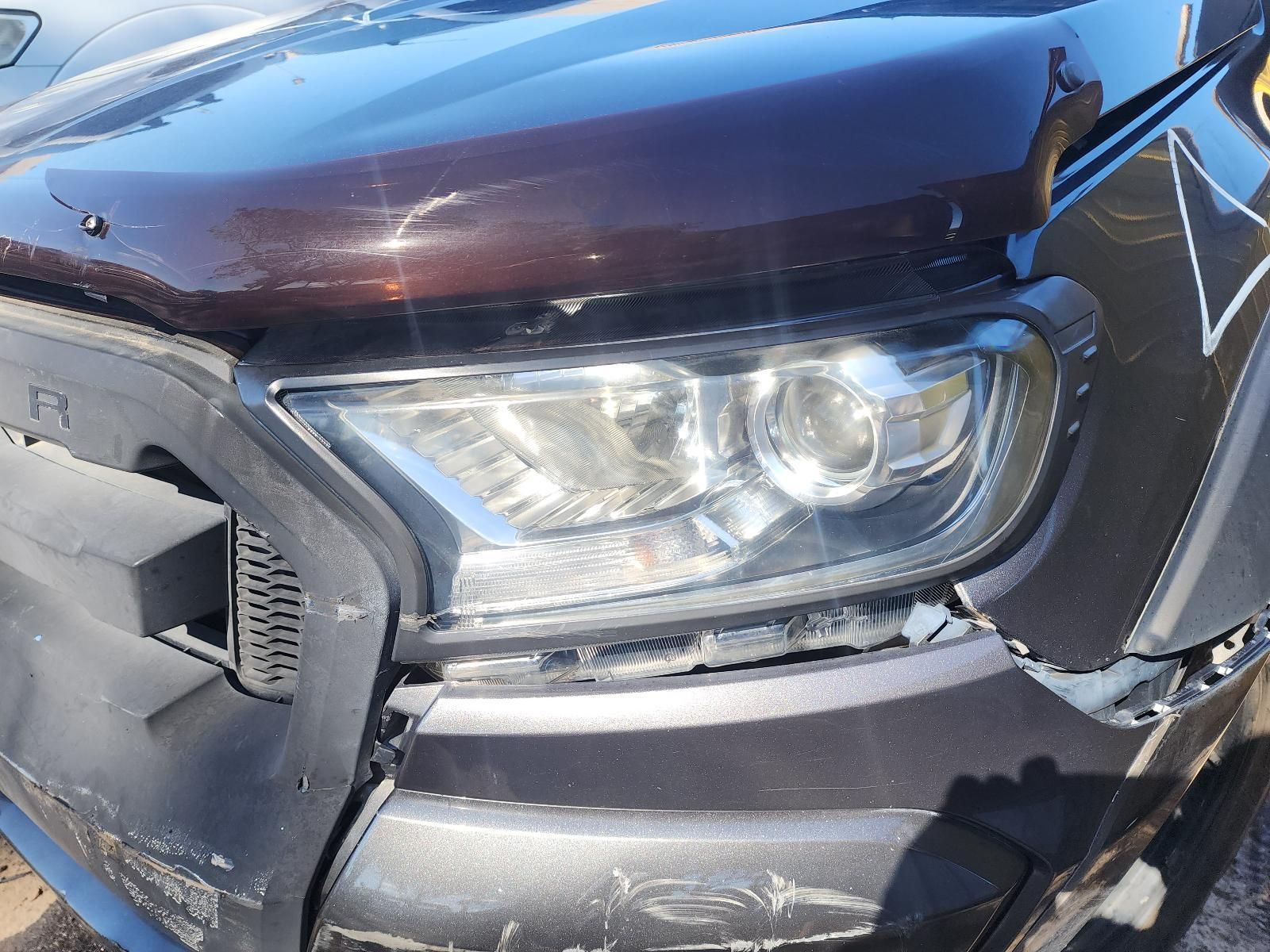 Close-up of a Damaged Dark SUV Front End — South West 4WD Wreckers In Harristown, QLD