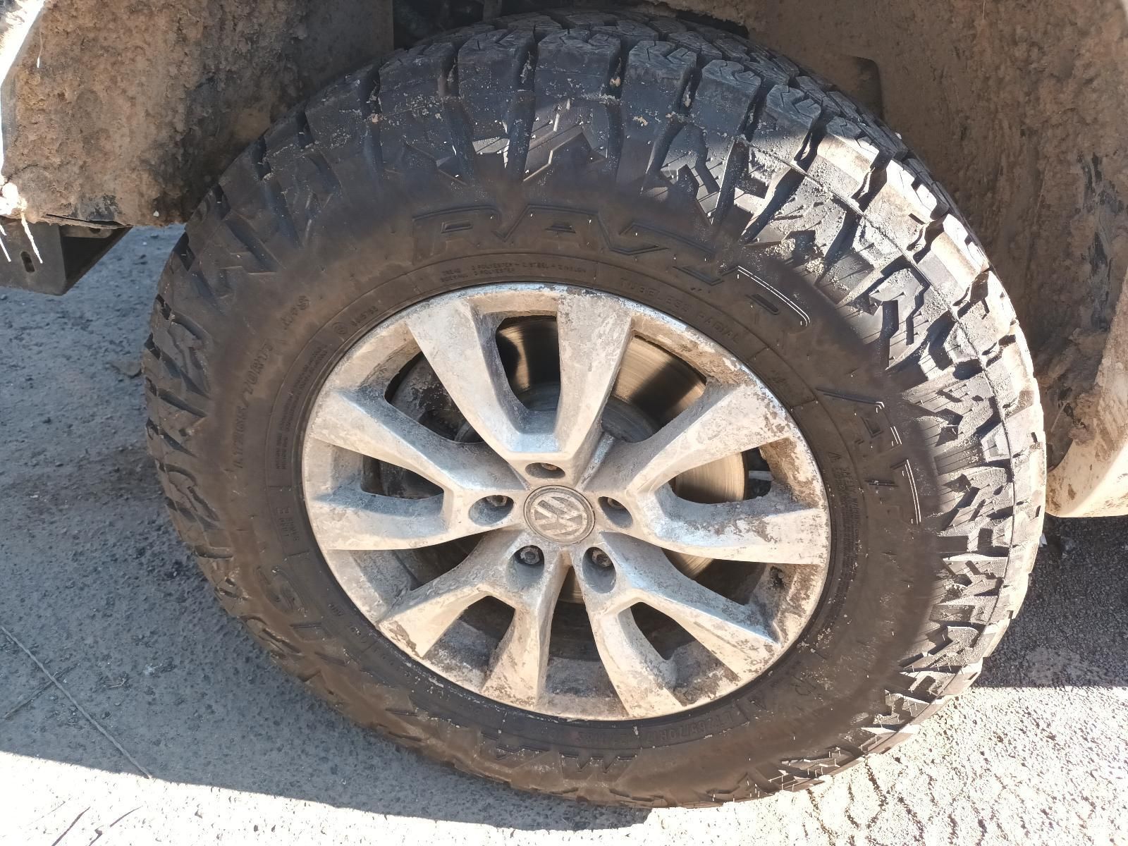 Close-Up of A Muddy Off-Road Tire and Silver Wheel on A Vehicle — South West 4WD Wreckers In Harristown, QLD