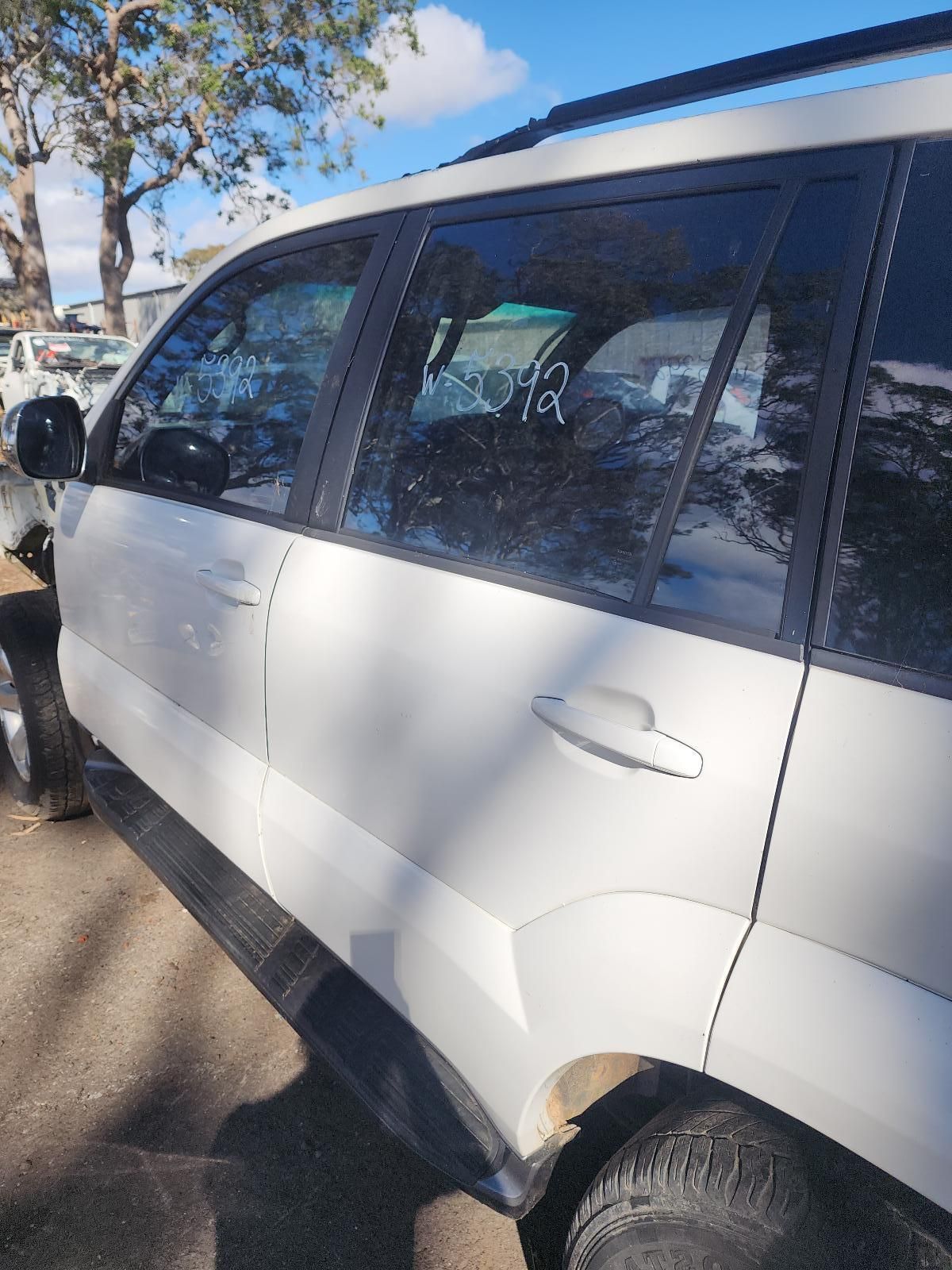 White SUV Parked Outdoors in Sunlight — South West 4WD Wreckers In Harristown, QLD