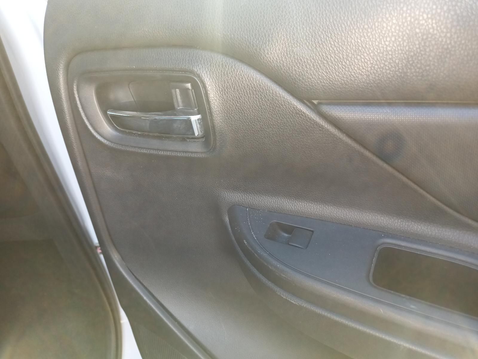 Car Interior Door Panel with Black Handle, Window Switch, and Grey Armrest — South West 4WD Wreckers In Harristown, QLD