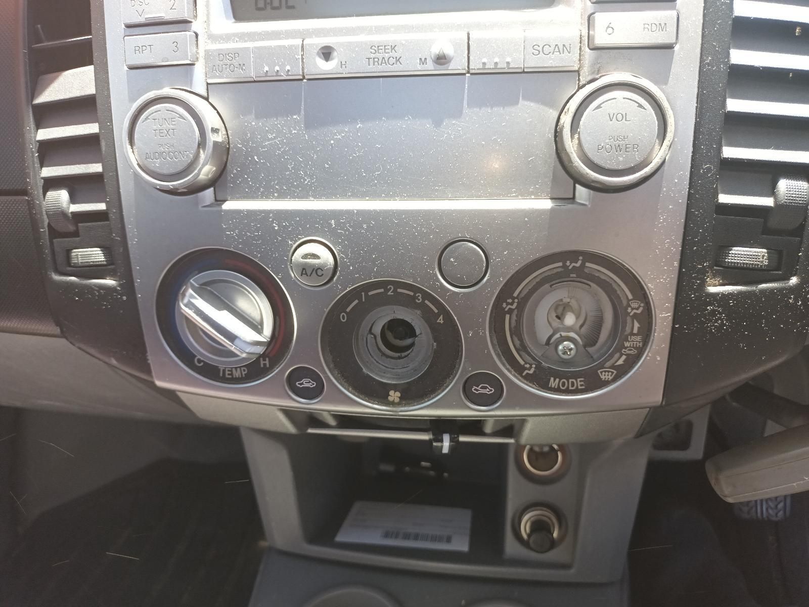 Car Dashboard Centre Console with Radio, Climate Controls — South West 4WD Wreckers In Harristown, QLD