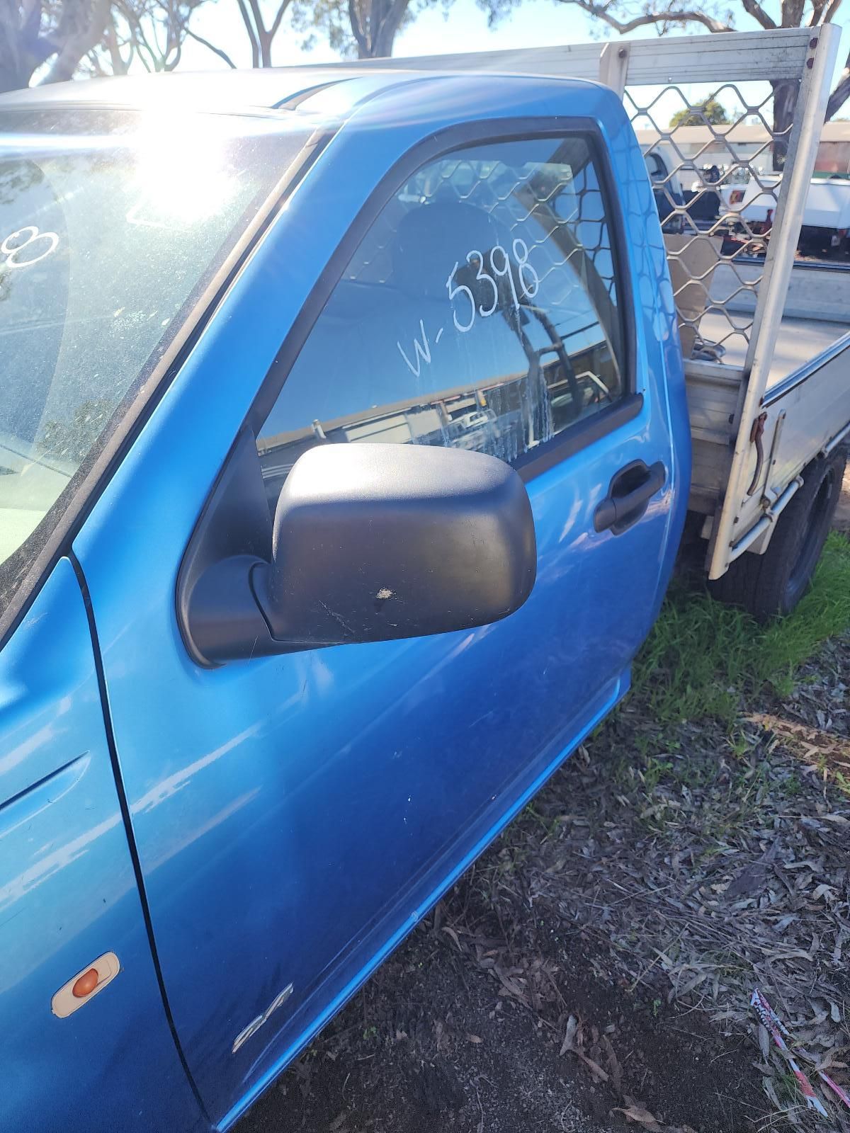 Blue Pickup Truck With Damaged Side Panel — South West 4WD Wreckers In Harristown, QLD