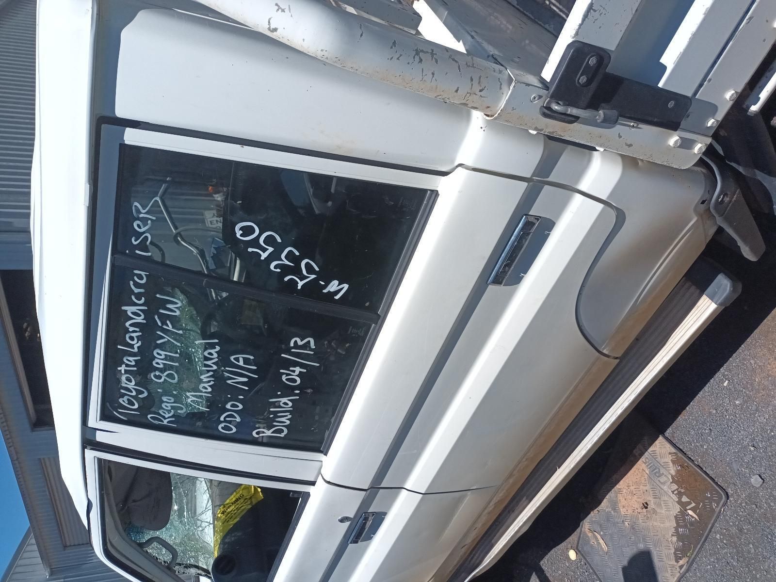 White Car Parked on Street with Chalk Writing on The Rear Window and Side Door — South West 4WD Wreckers In Harristown, QLD