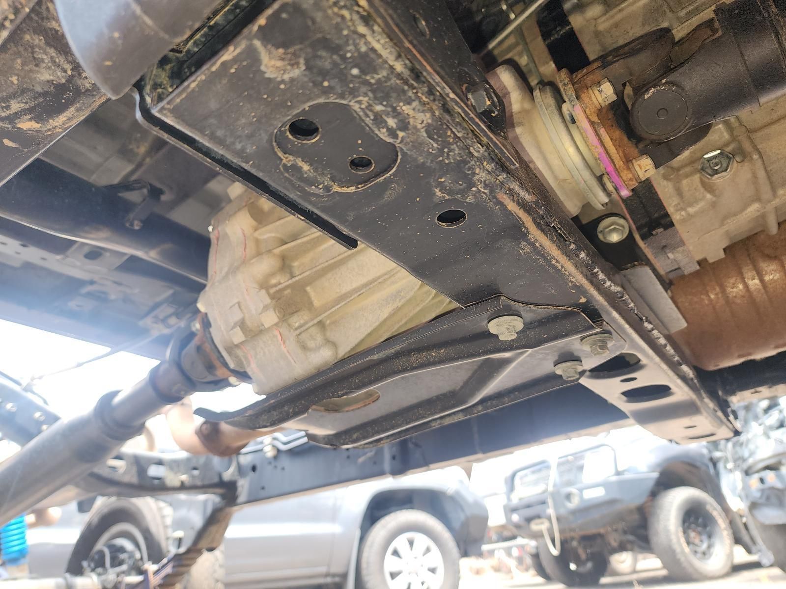 Undercarriage of a Vehicle on a Lift, Showing the Frame — South West 4WD Wreckers In Harristown, QLD