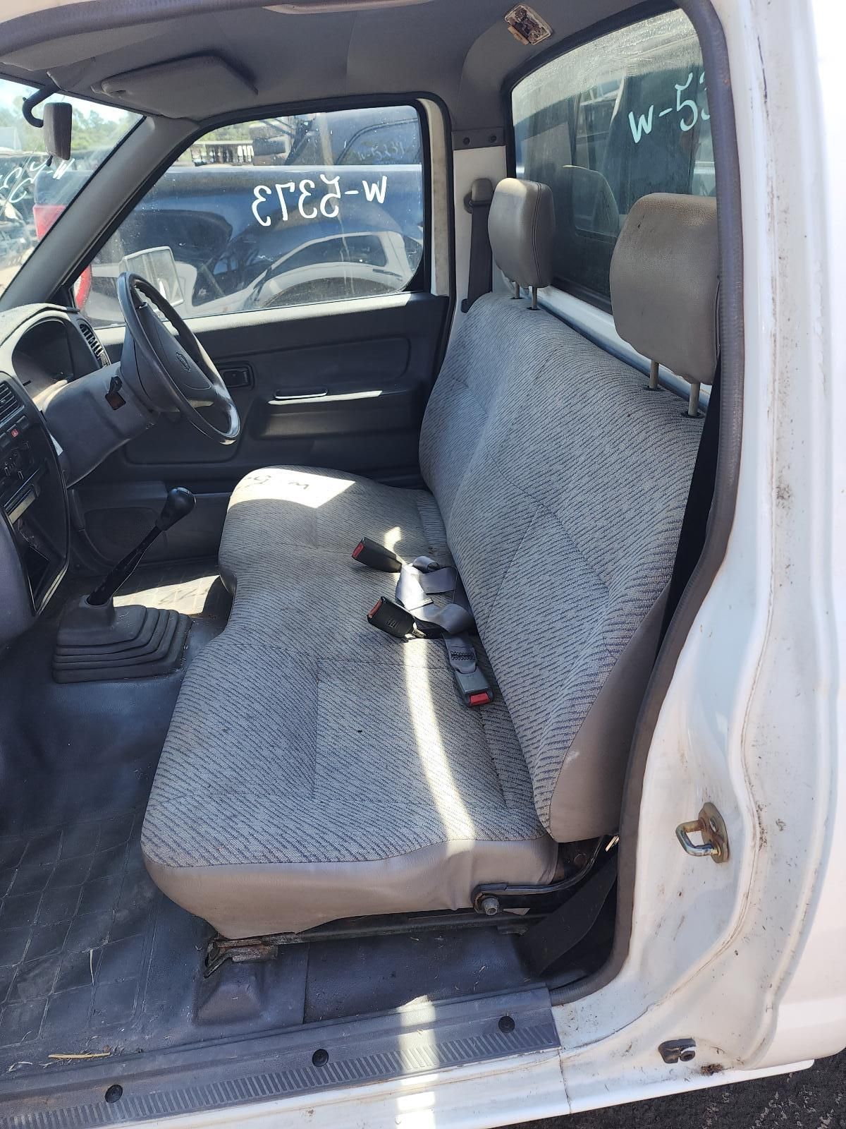 White Truck Interior With Gray Bench Seat and Black Steering Wheel — South West 4WD Wreckers In Harristown, QLD