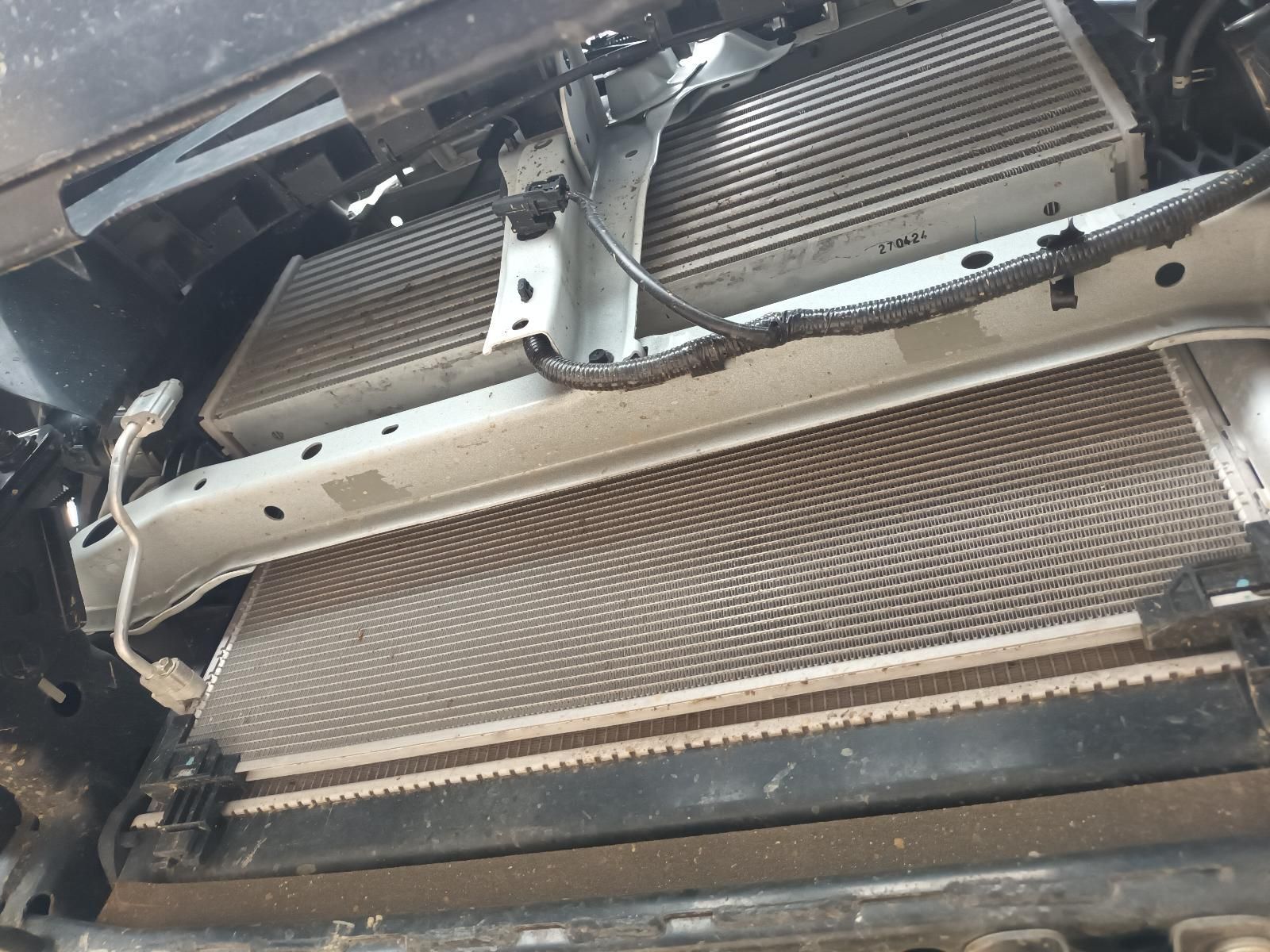 Damaged Car Front with Bent Bumper Support and Exposed Radiator Components — South West 4WD Wreckers In Harristown, QLD